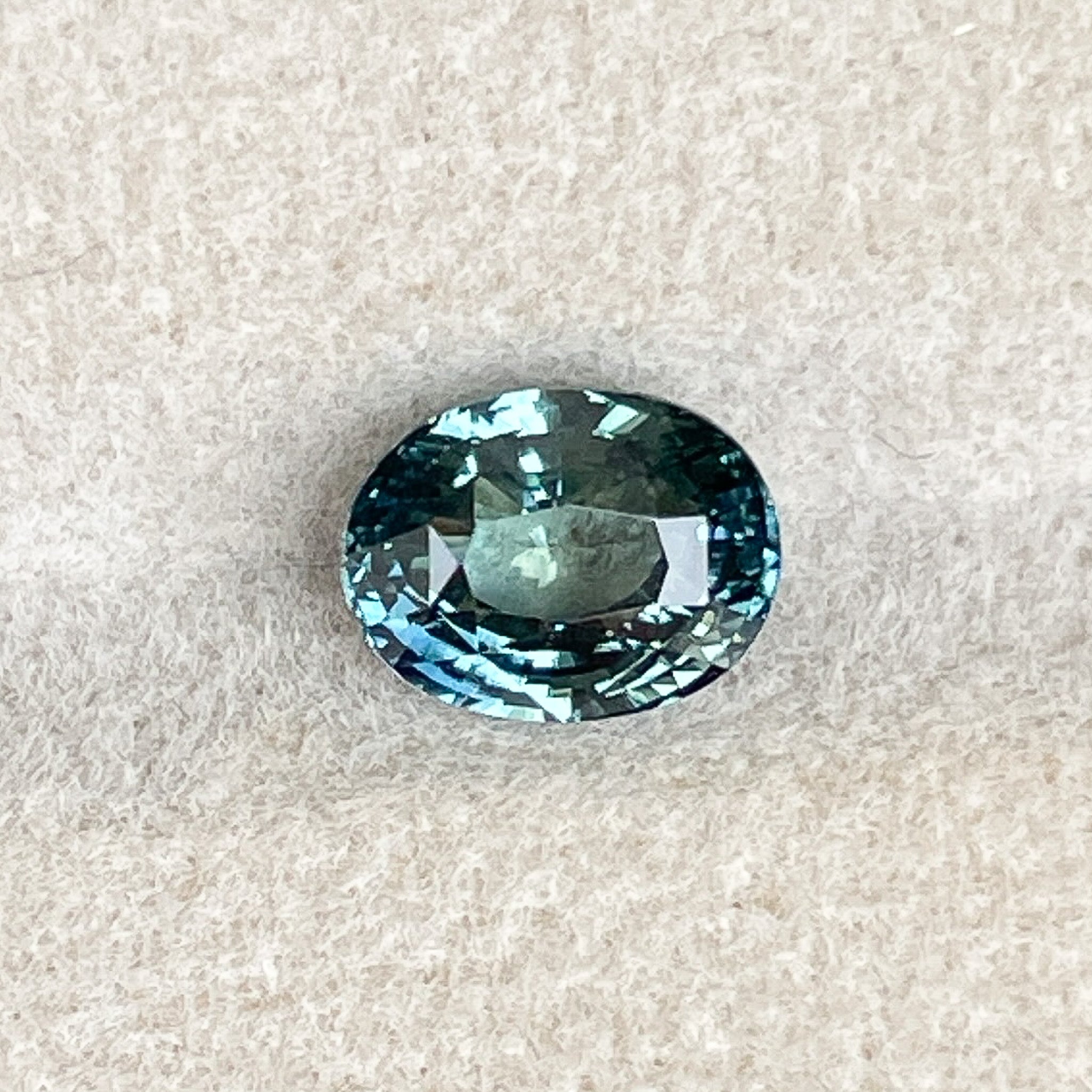 Natural teal blue-green sapphire 2.03 Ct oval cut loose gemstone by NASHGEMS, ideal for engagement rings and custom jewelry.