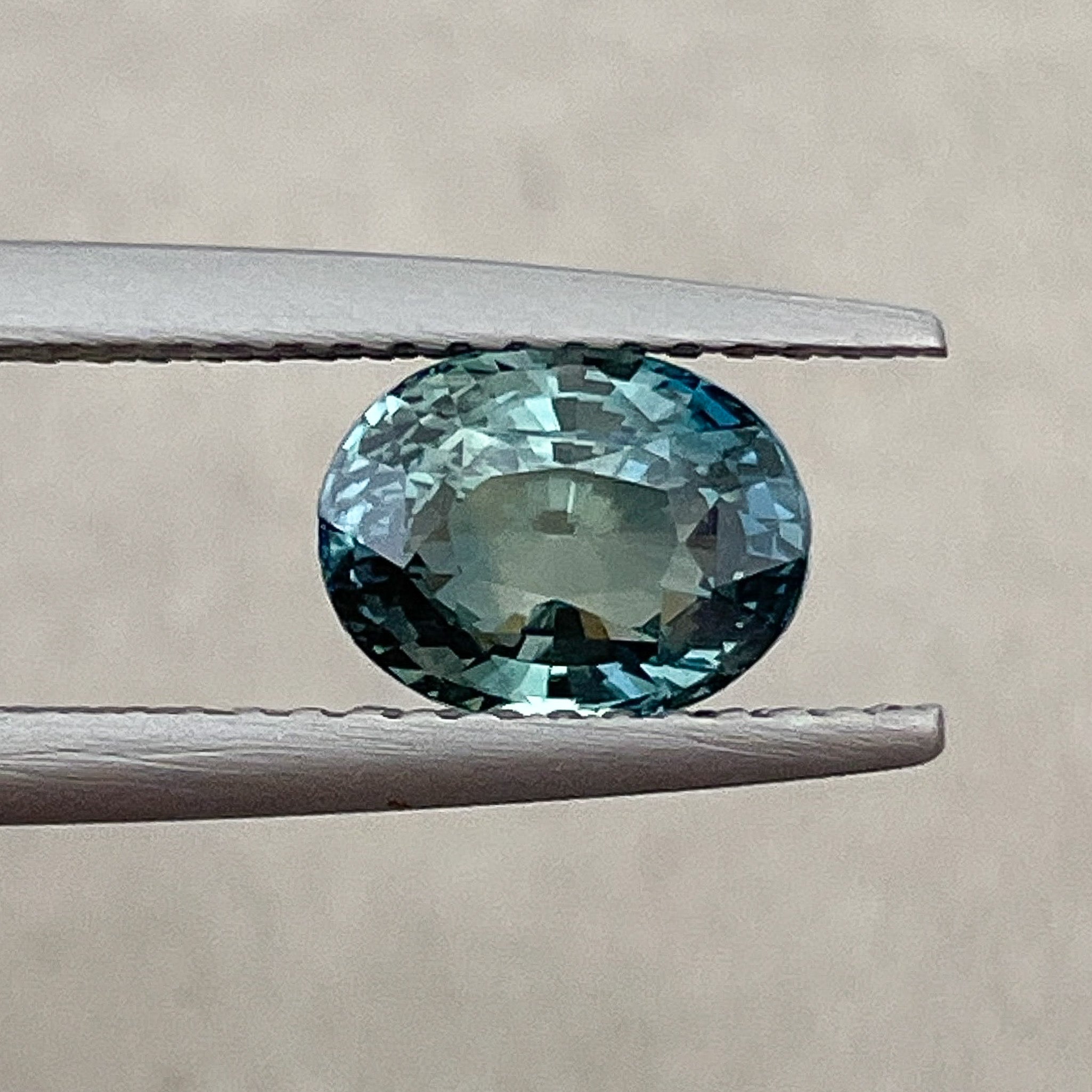 Natural teal blue-green sapphire loose stone, 2.03 Ct oval cut by NASHGEMS, ideal for engagement rings or custom jewelry.
