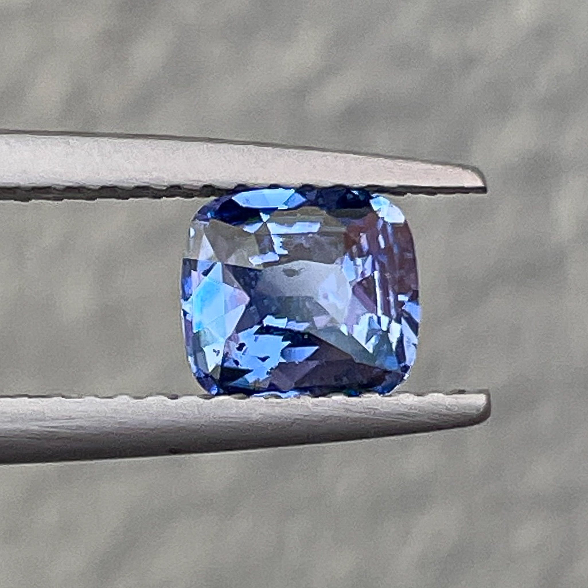 Natural Ceylon Blue Sapphire 1.06 Ct cushion cut loose gemstone from NASHGEMS, showcasing vibrant blue color and clarity.