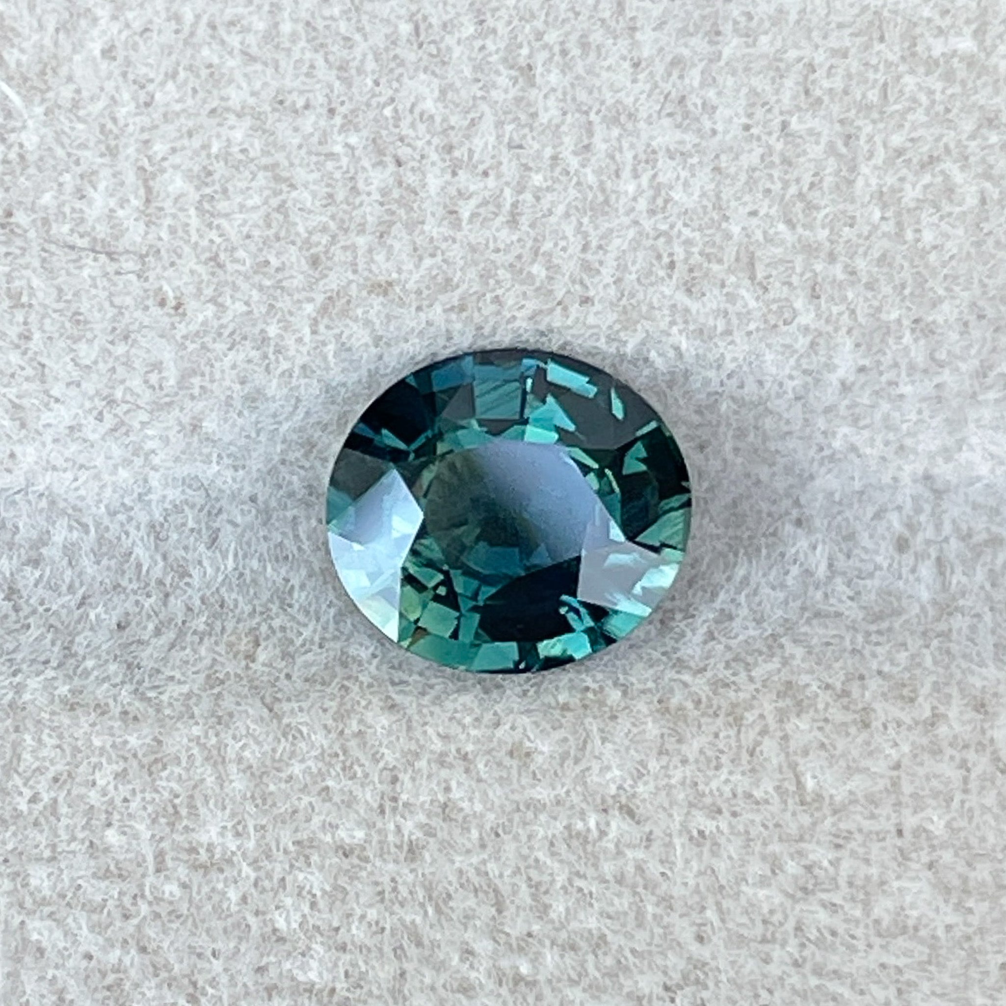 Forest green sapphire, 1.56 Ct oval cut loose teal gemstone by NASHGEMS, ideal for engagement rings or custom jewelry.