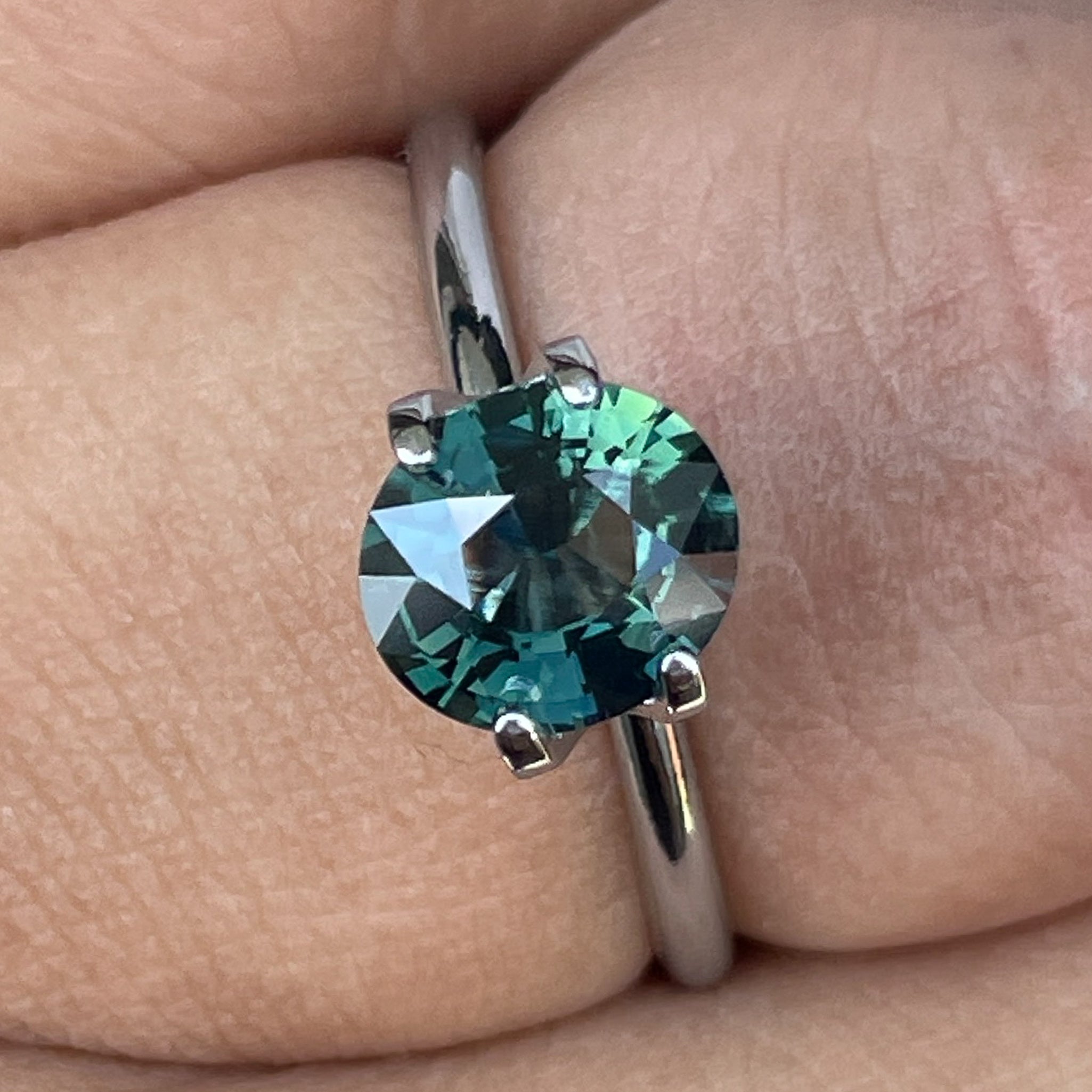 Natural forest green sapphire, 1.56 Ct oval cut loose gemstone by NASHGEMS, perfect for engagement rings or custom jewelry.