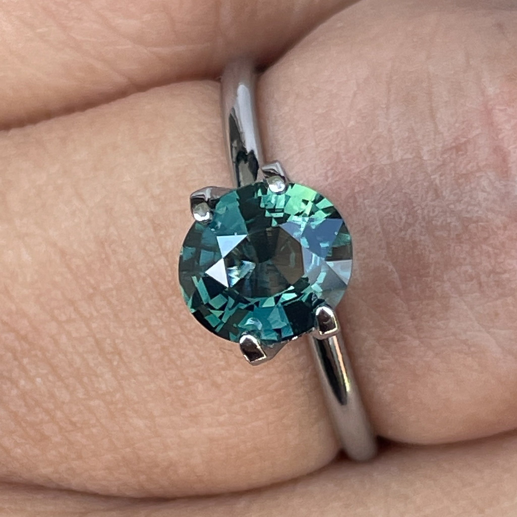 Natural forest green sapphire, 1.56 Ct oval cut loose teal gemstone from NASHGEMS, ideal for engagement rings or custom jewelry.