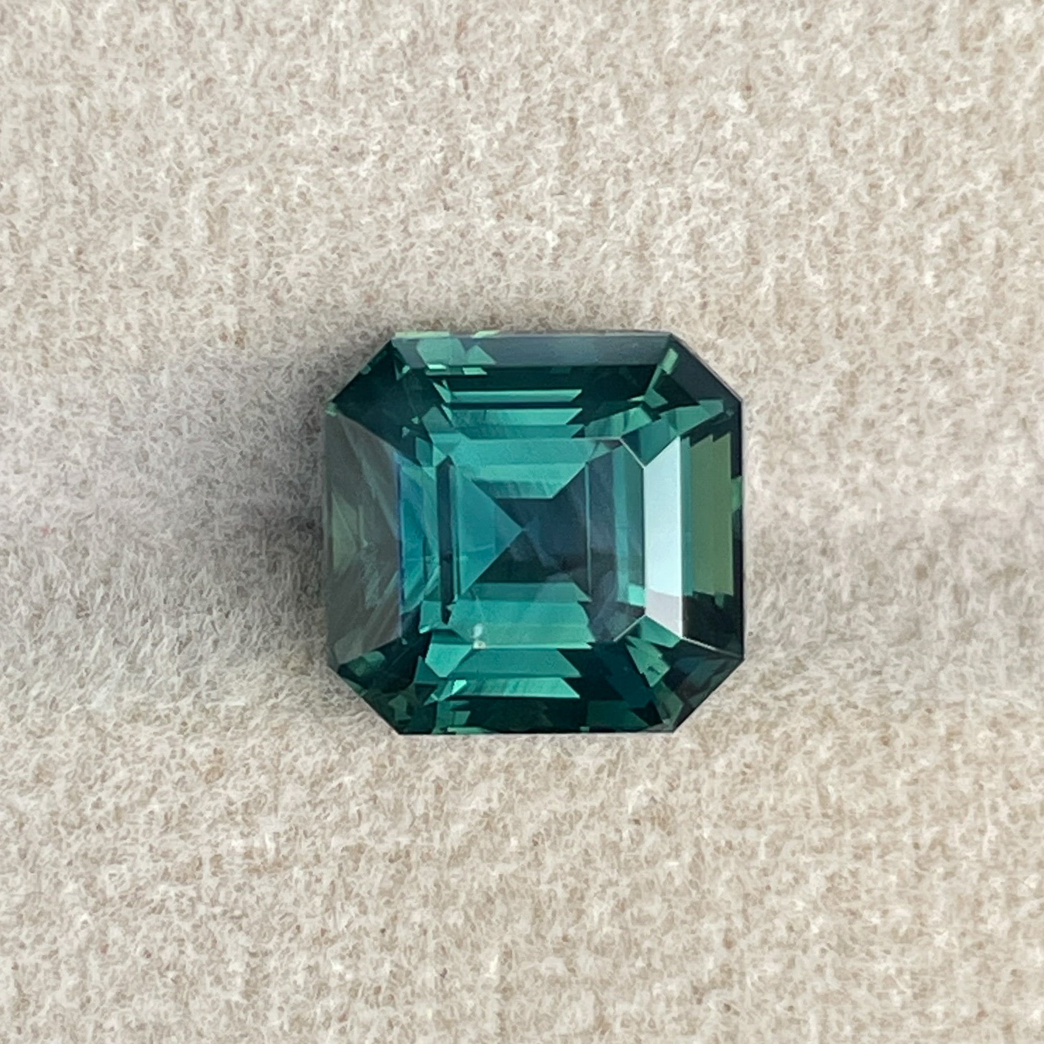Natural green sapphire 5.08 Ct Asscher emerald cut loose gemstone by NASHGEMS, ideal for engagement rings or custom jewelry.