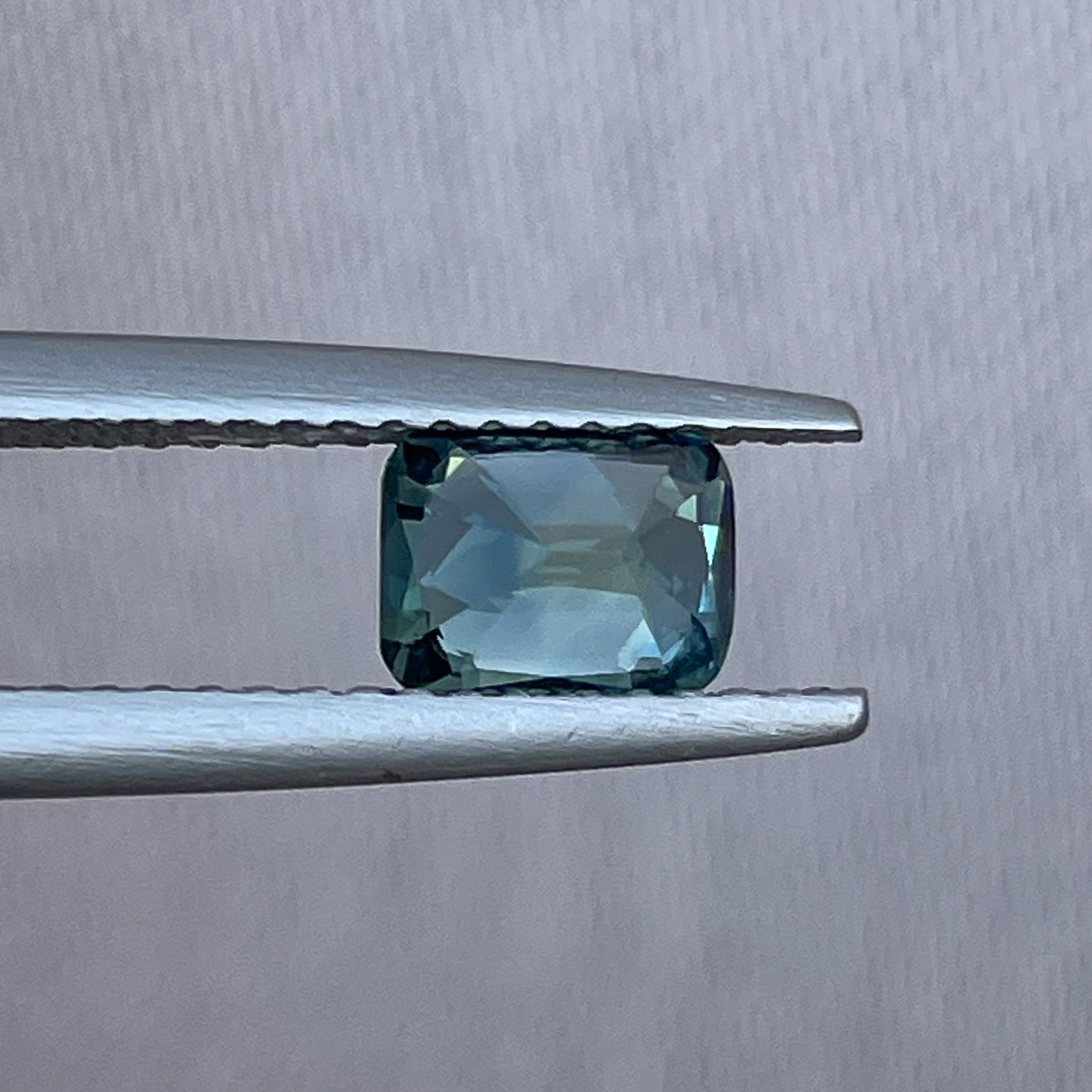 Teal green sapphire loose gemstone, 1.11 Ct cushion cut, heat treated, from NASHGEMS, ideal for engagement or custom jewelry.