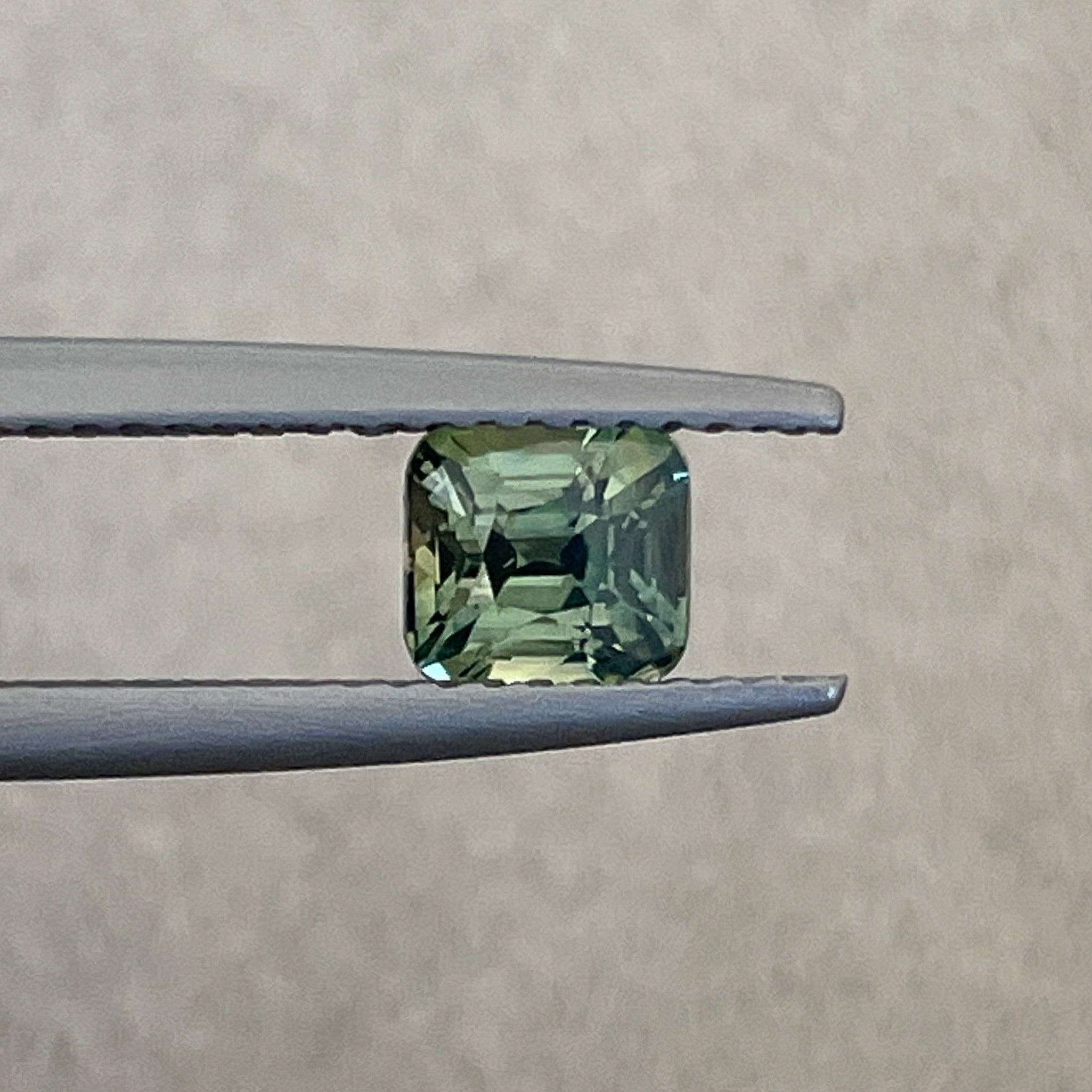 Natural pale green sapphire by NASHGEMS, 1.06 ct cushion cut teal loose gemstone for engagement or custom jewelry.
