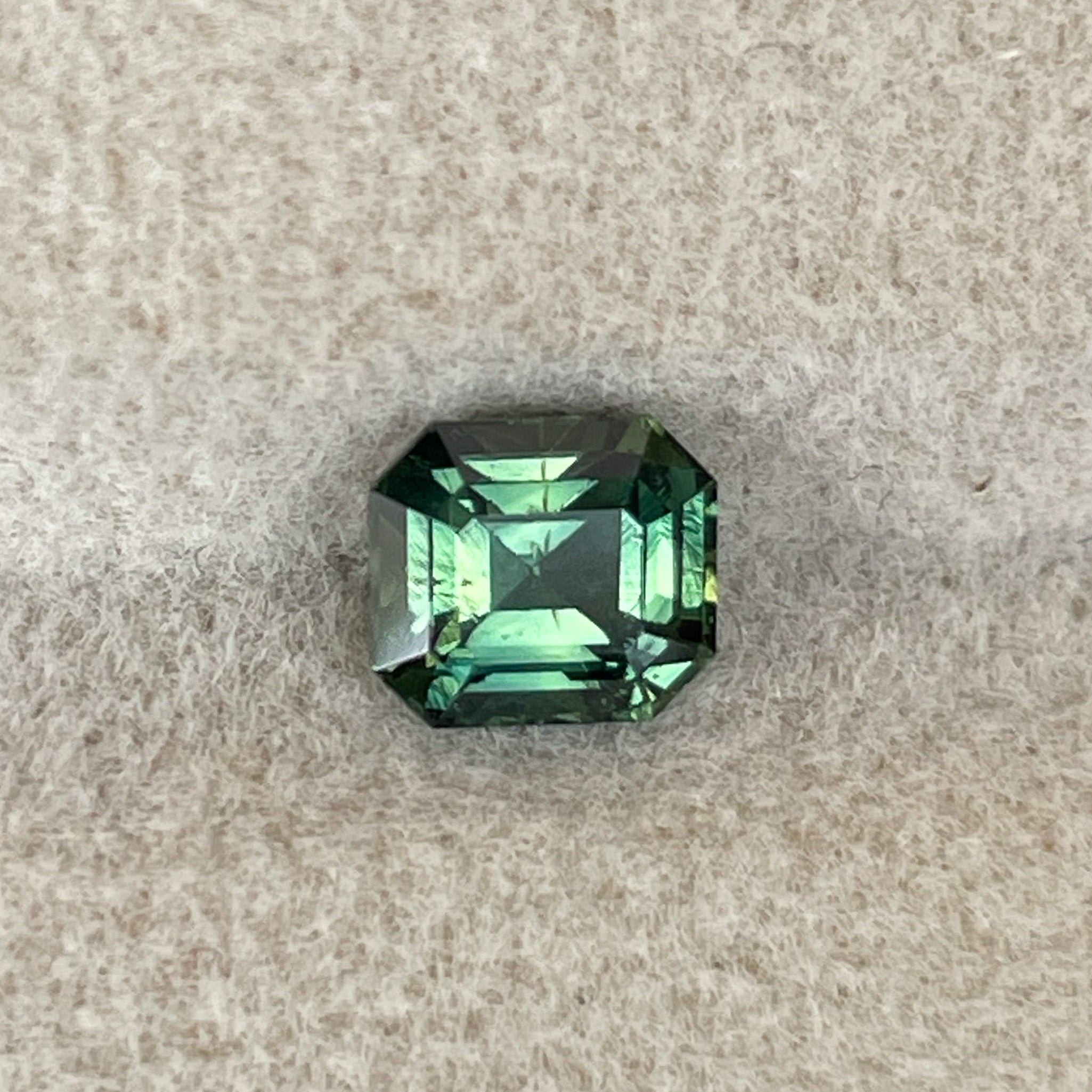 Natural green sapphire 1.04 Ct emerald cut loose gemstone by NASHGEMS, ideal for engagement rings or custom jewelry.
