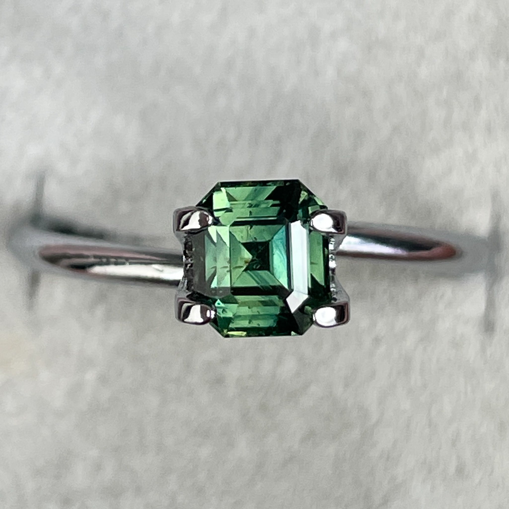 Natural green sapphire 1.04 Ct emerald cut loose gemstone from NASHGEMS, ideal for engagement rings or custom jewelry.