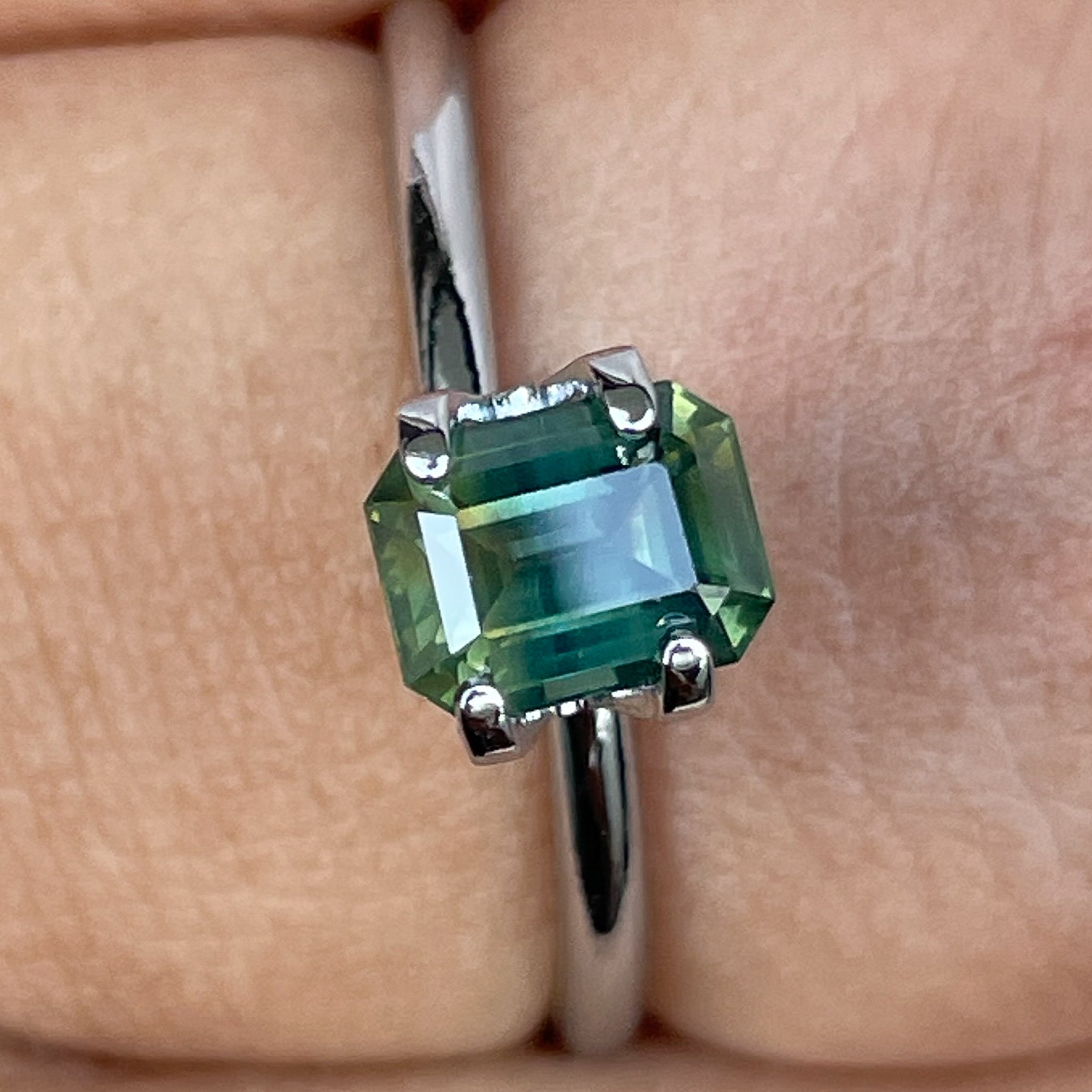 Teal natural bi-color sapphire 1.13 Ct emerald cut loose gemstone from NASHGEMS, suitable for engagement rings or custom jewelry.