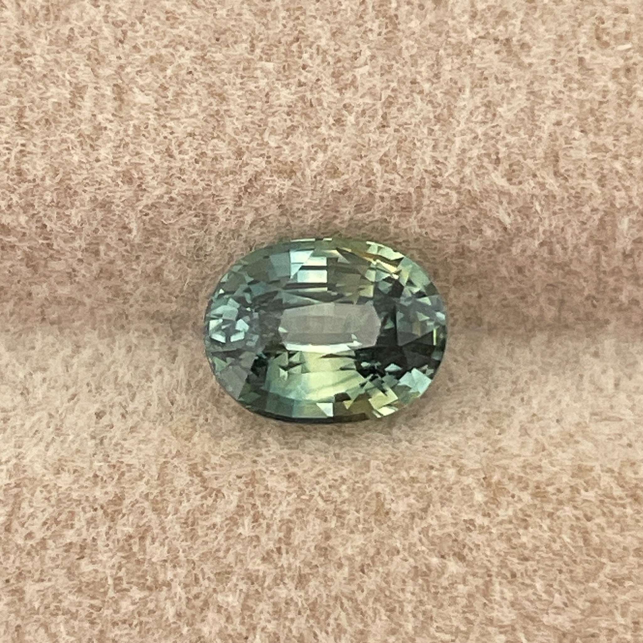 Teal green sapphire loose gemstone, 1.45 Ct oval cut by NASHGEMS, perfect for engagement rings or custom jewelry.