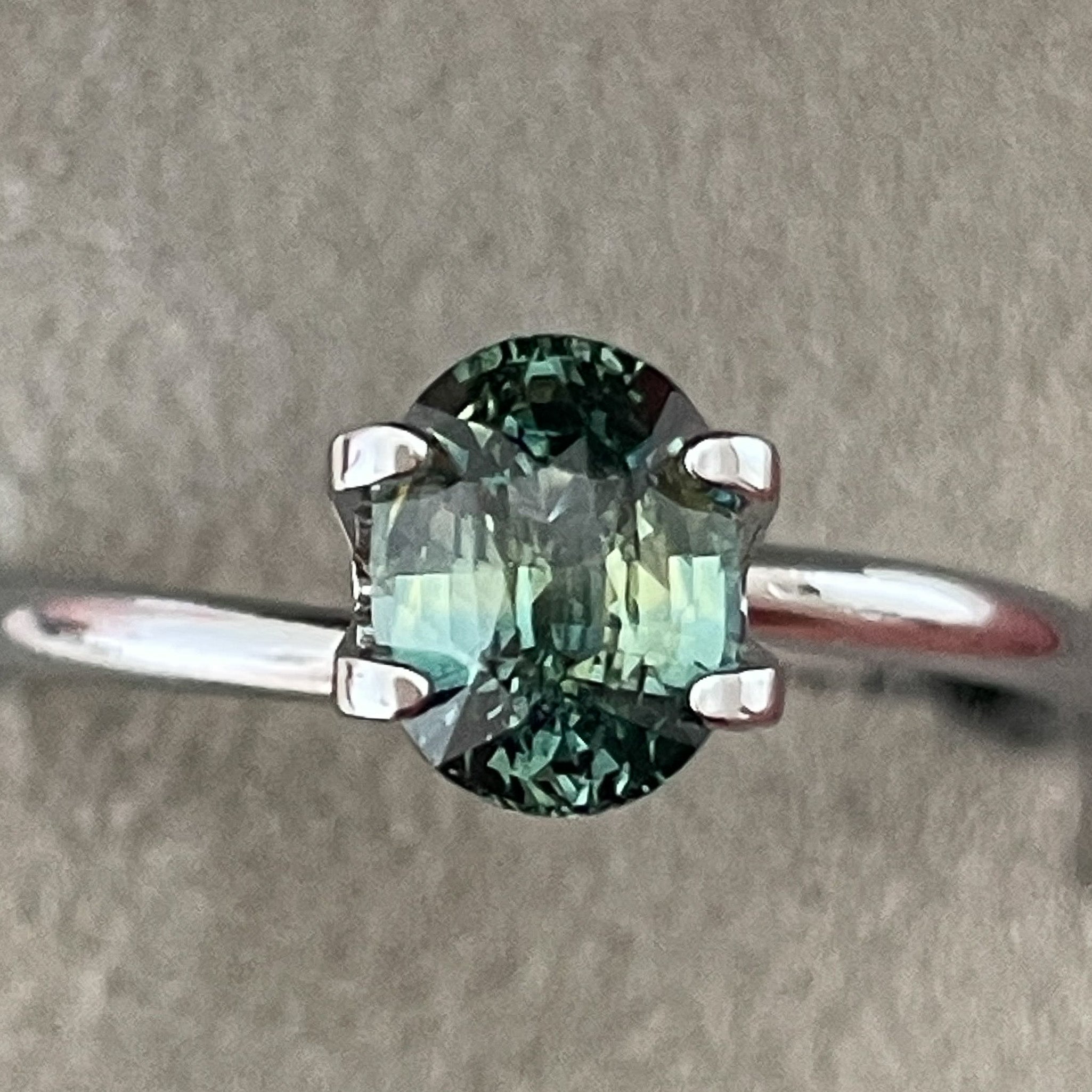 Natural teal green sapphire loose stone, 1.45 Ct oval cut by NASHGEMS, perfect for engagement or custom jewelry.