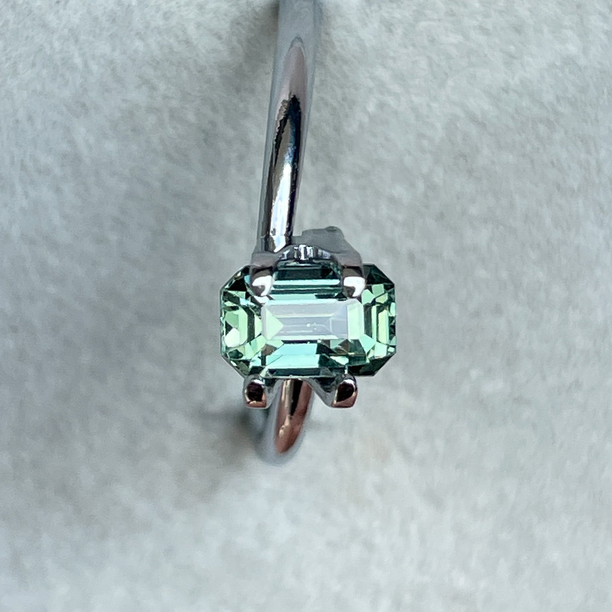 Natural pale green teal sapphire 1.24 Ct emerald cut by NASHGEMS, loose gemstone ideal for engagement rings or custom jewelry.
