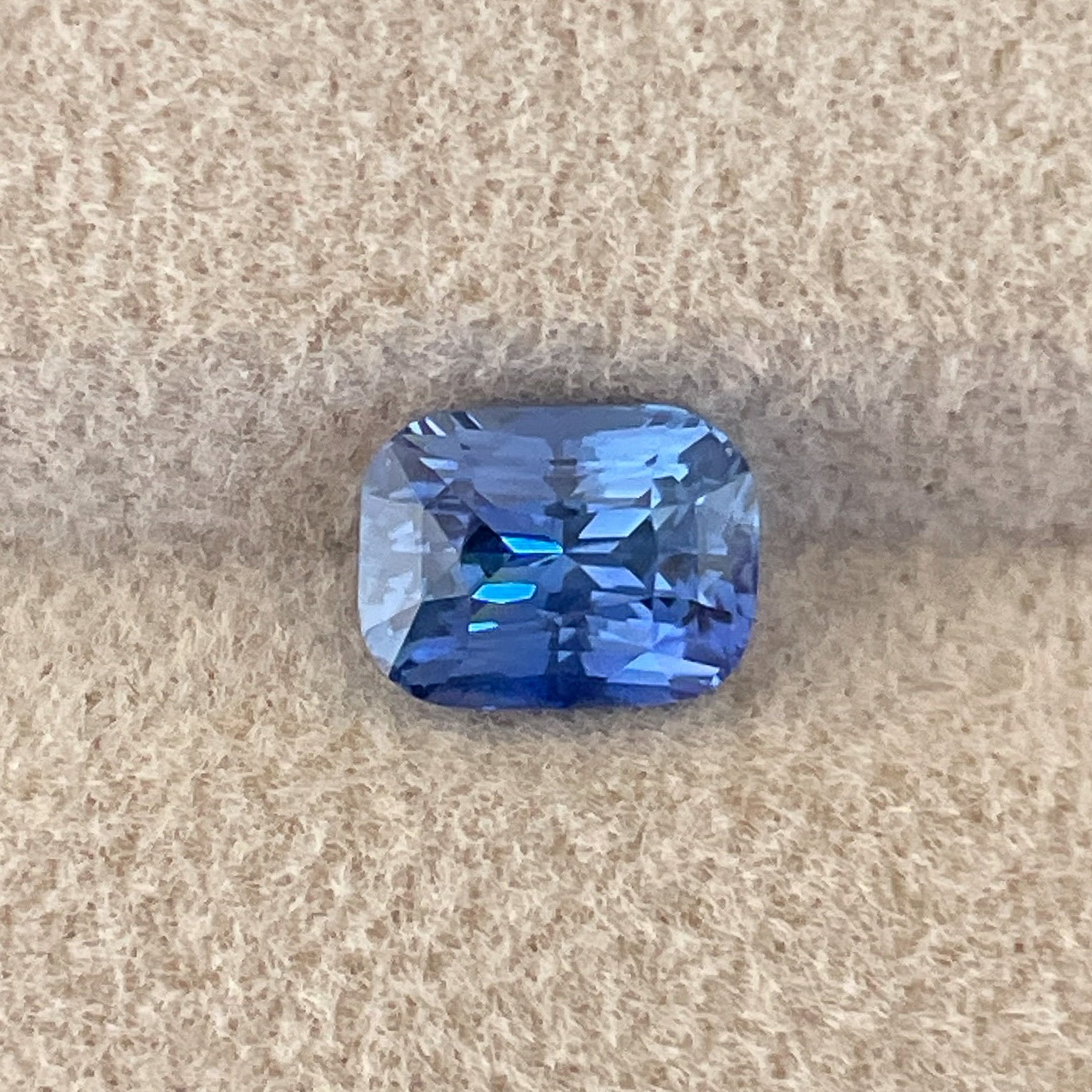 Natural Ceylon Blue Sapphire 1.60 Ct cushion cut, vivid blue loose gemstone from NASHGEMS for jewelry or engagement rings.