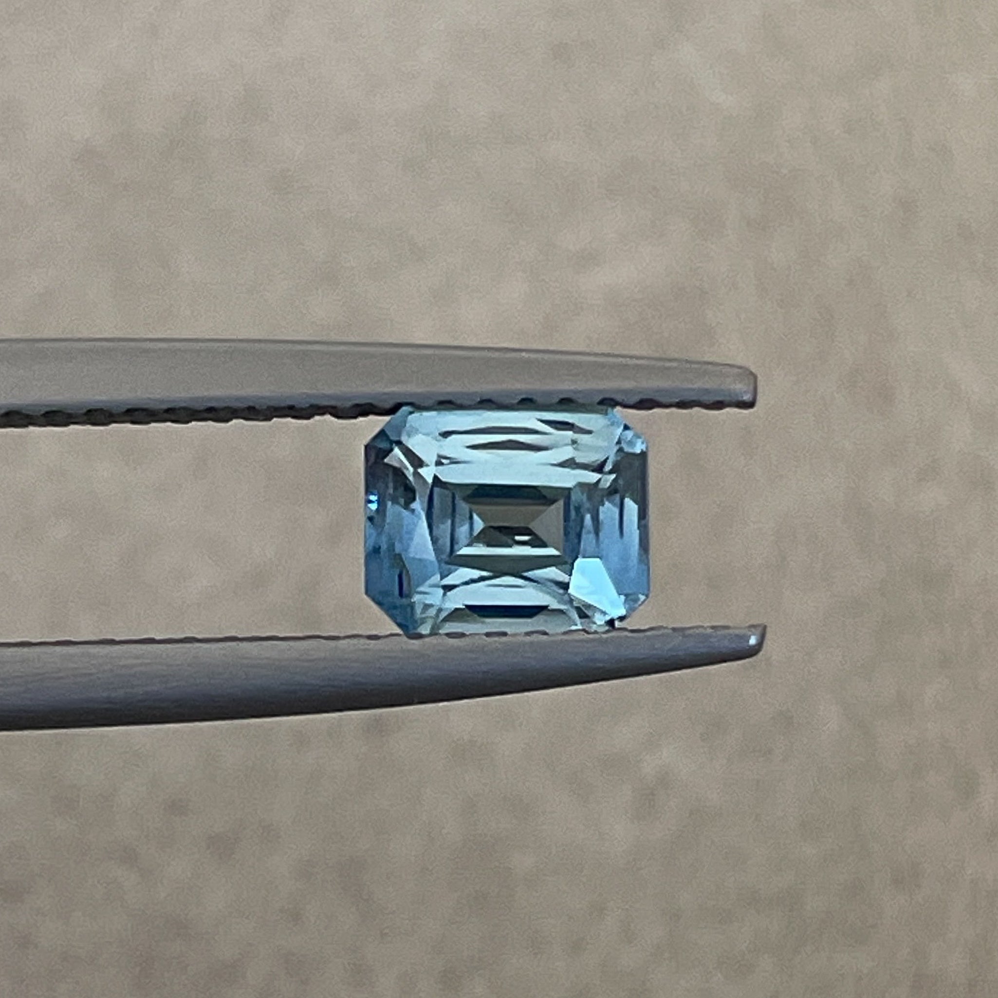 Natural pale blue sapphire, 1.08 ct emerald cut loose gemstone by NASHGEMS, perfect for engagement rings or custom jewelry.