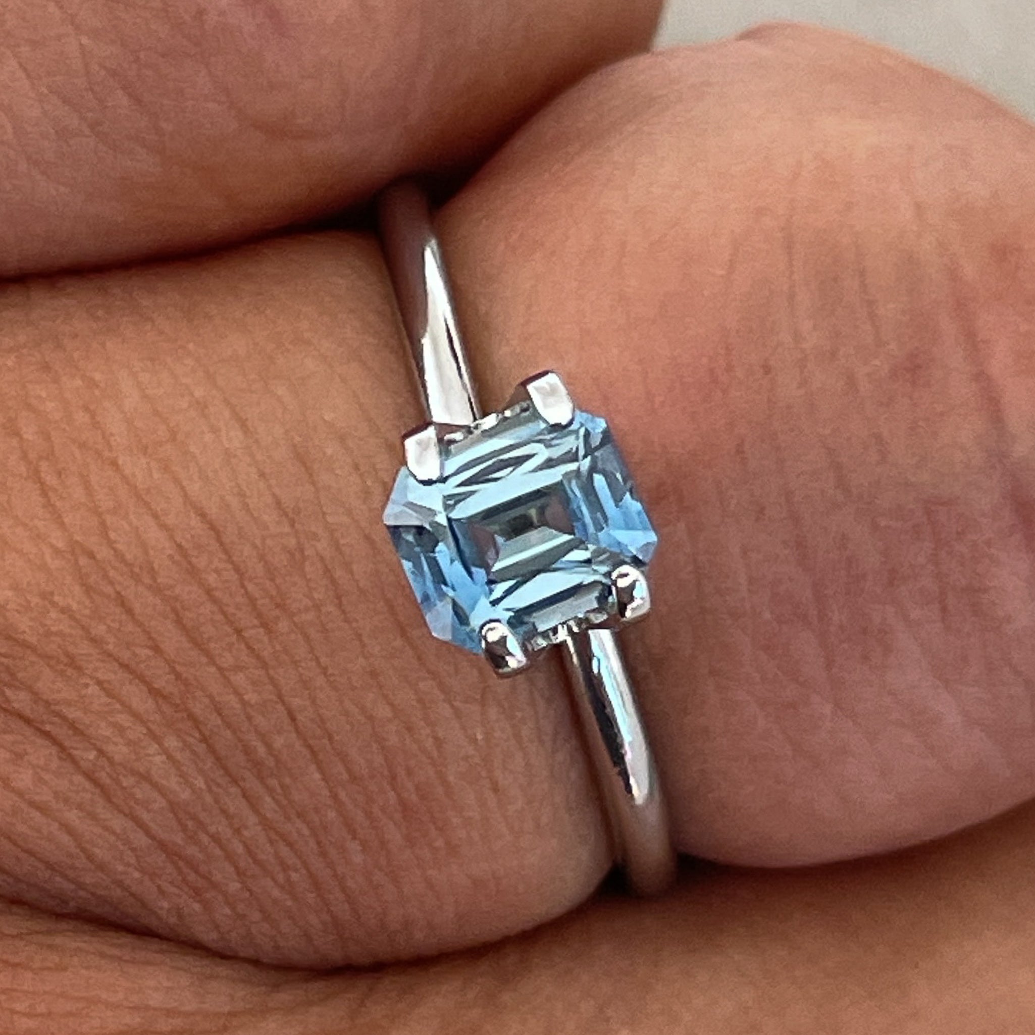 Natural pale blue sapphire 1.08 Ct teal emerald cut loose gemstone from NASHGEMS, perfect for engagement or custom jewelry.