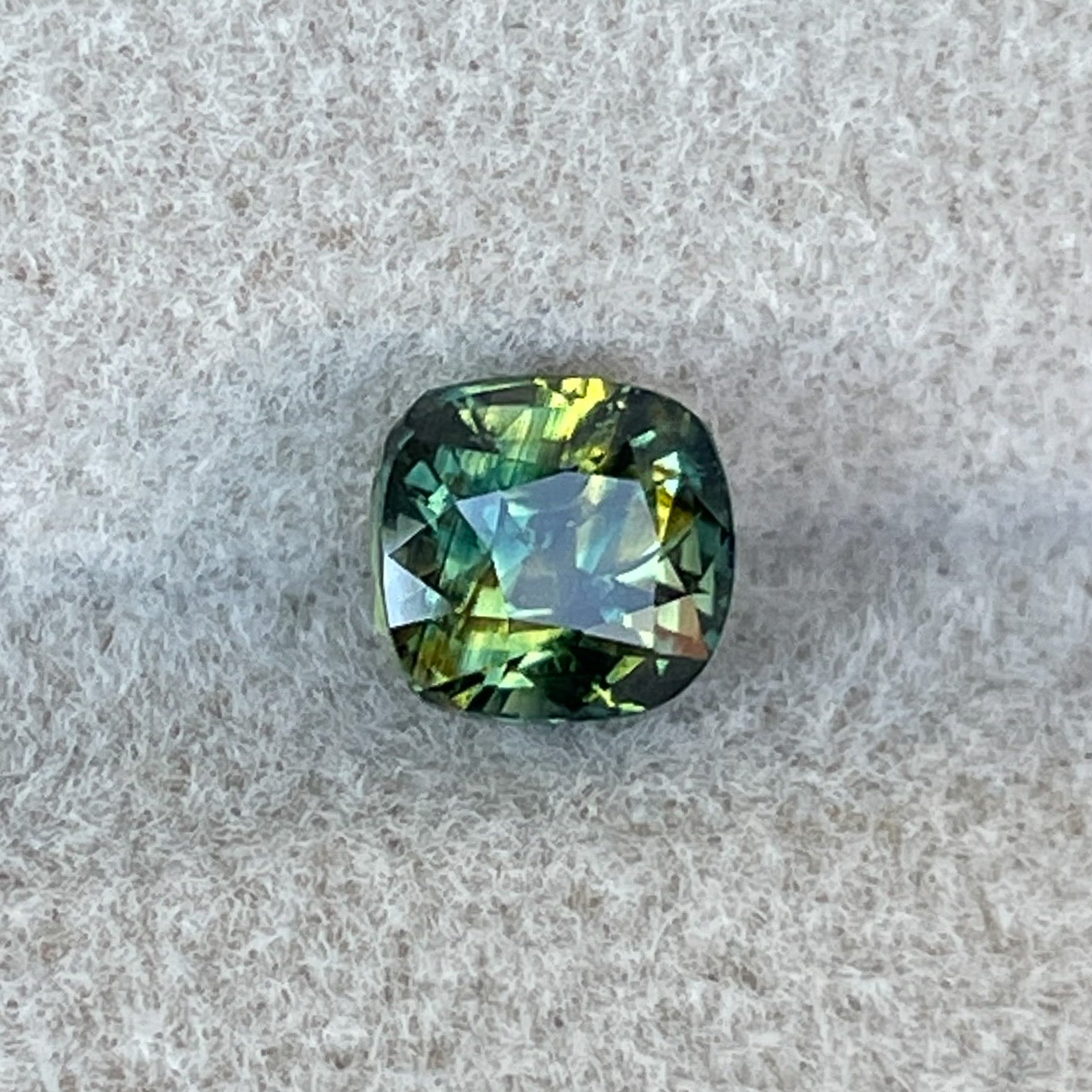 Teal Australian Parti Sapphire 1.10 Ct cushion cut, loose no heat sapphire by NASHGEMS, perfect for engagement or custom jewelry.