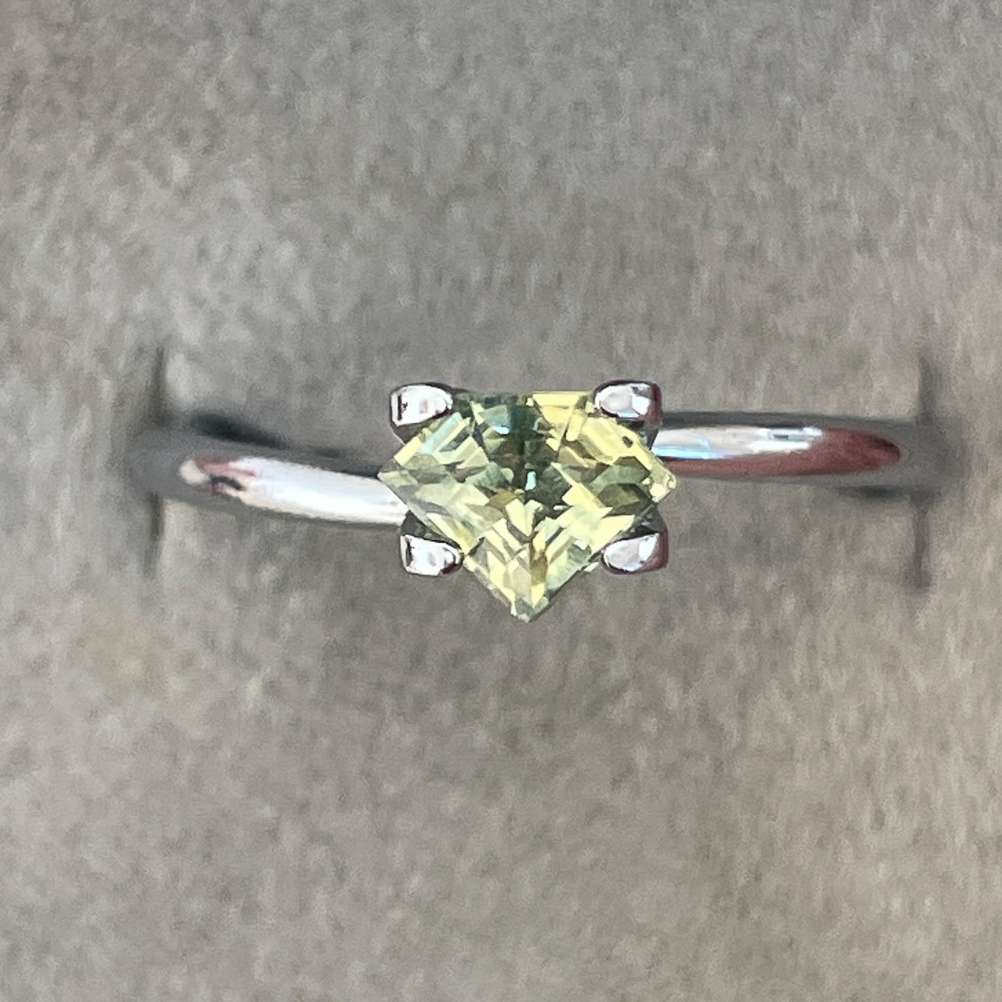 Natural pale green yellow sapphire, 0.72 ct shield cut teal gemstone by NASHGEMS, loose sapphire for engagement or custom jewelry.