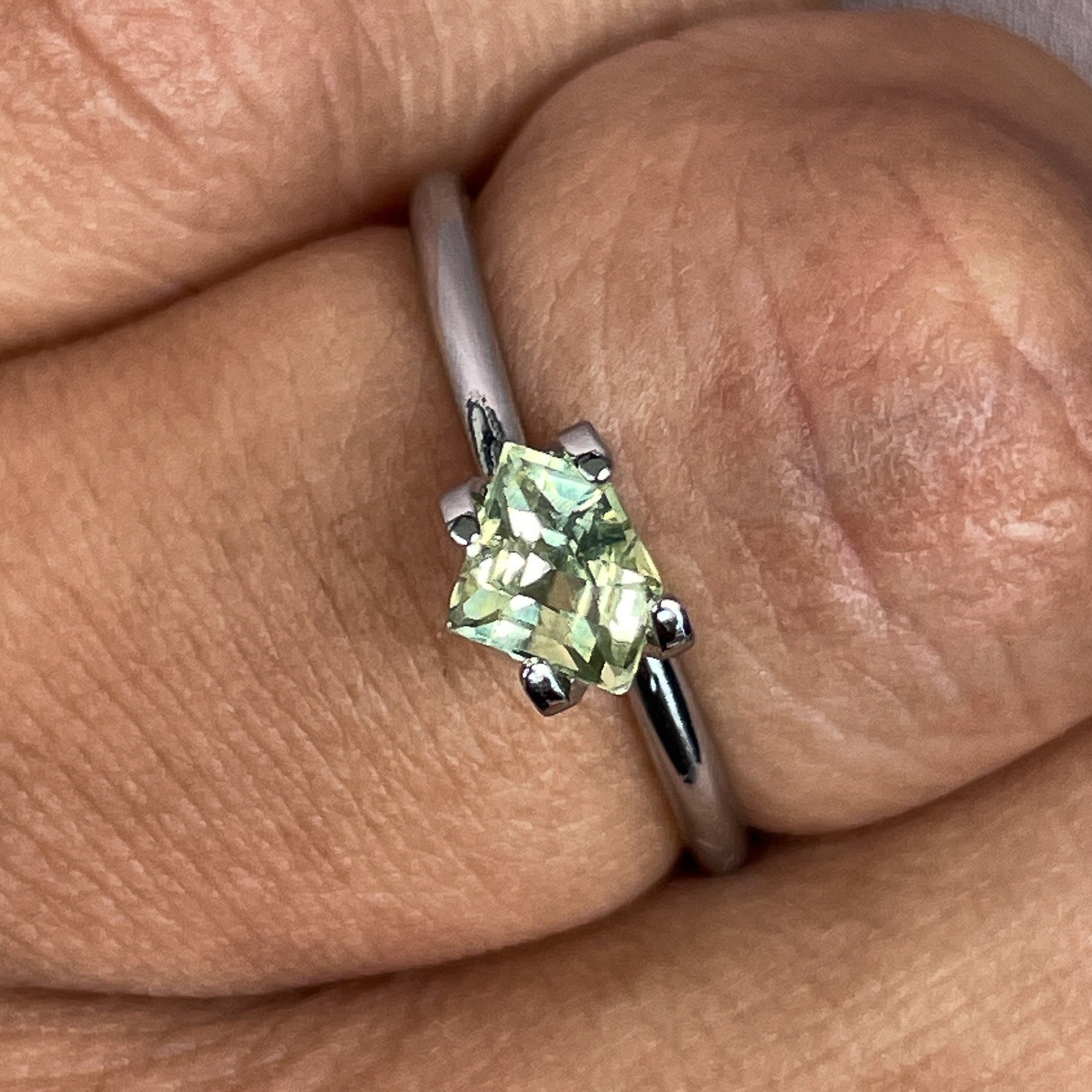 Natural teal yellow sapphire, 0.72 Ct shield cut loose gemstone by NASHGEMS, ideal for engagement rings or custom jewelry.
