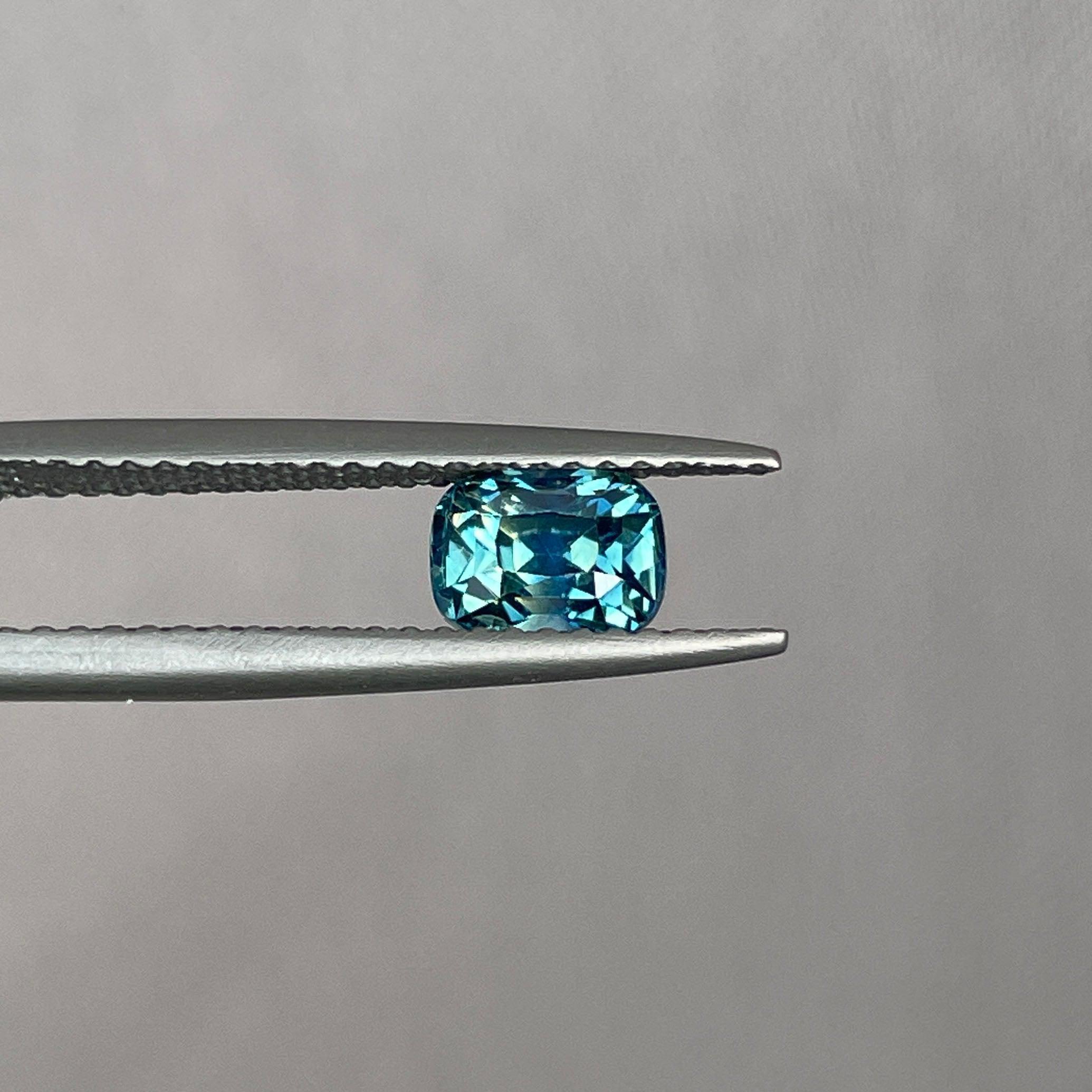 teal blue green parti sapphire cushion cut gem 