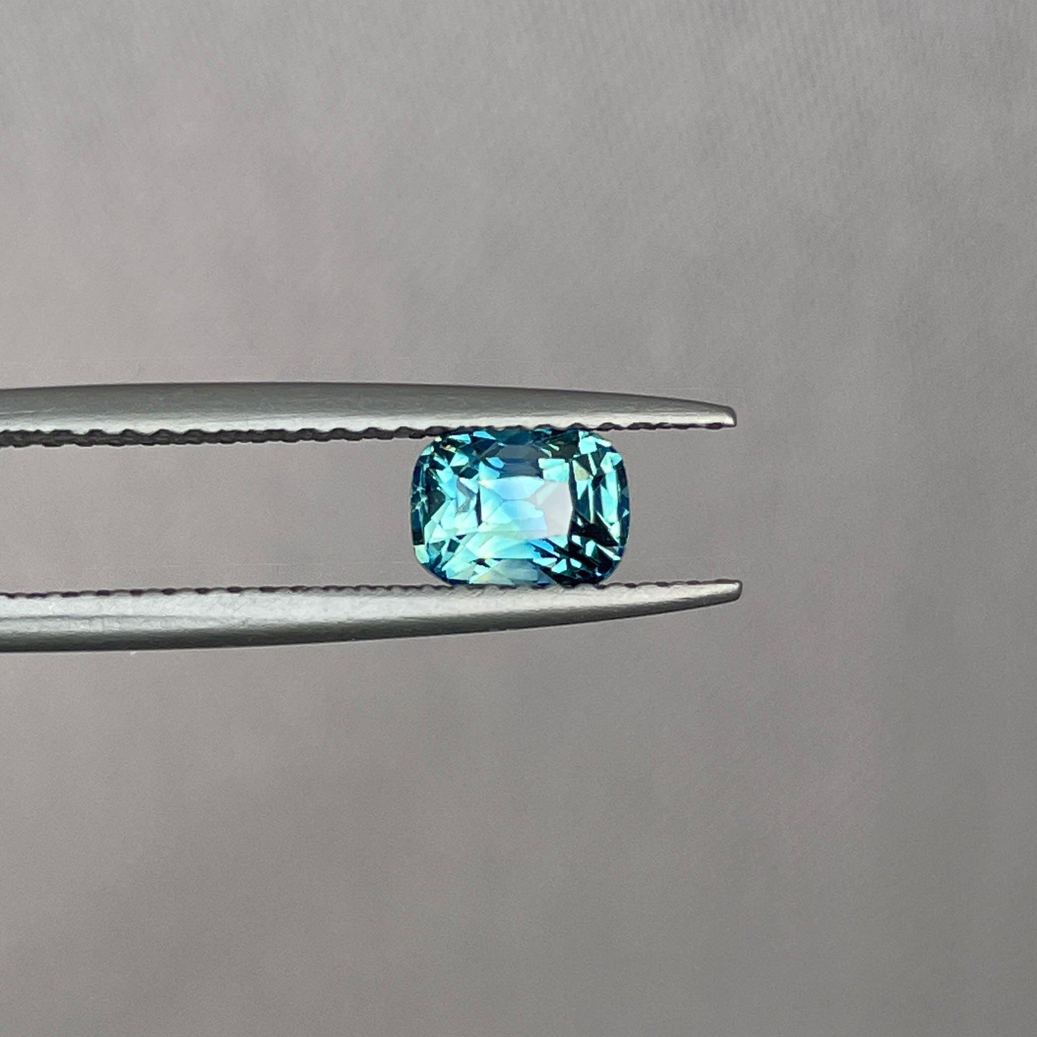 teal blue green parti sapphire cushion cut gem 