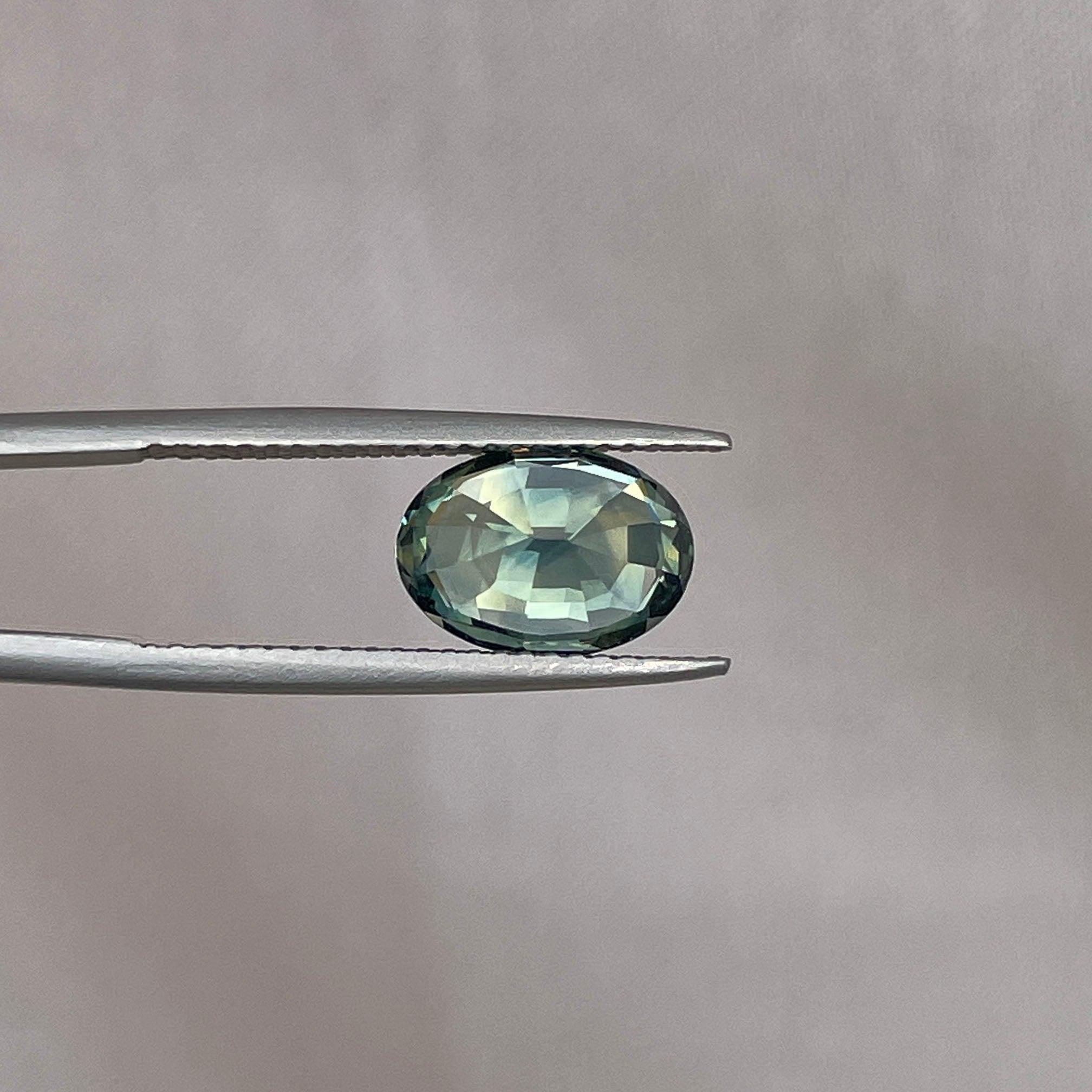 teal blue green parti sapphire oval cut gem 