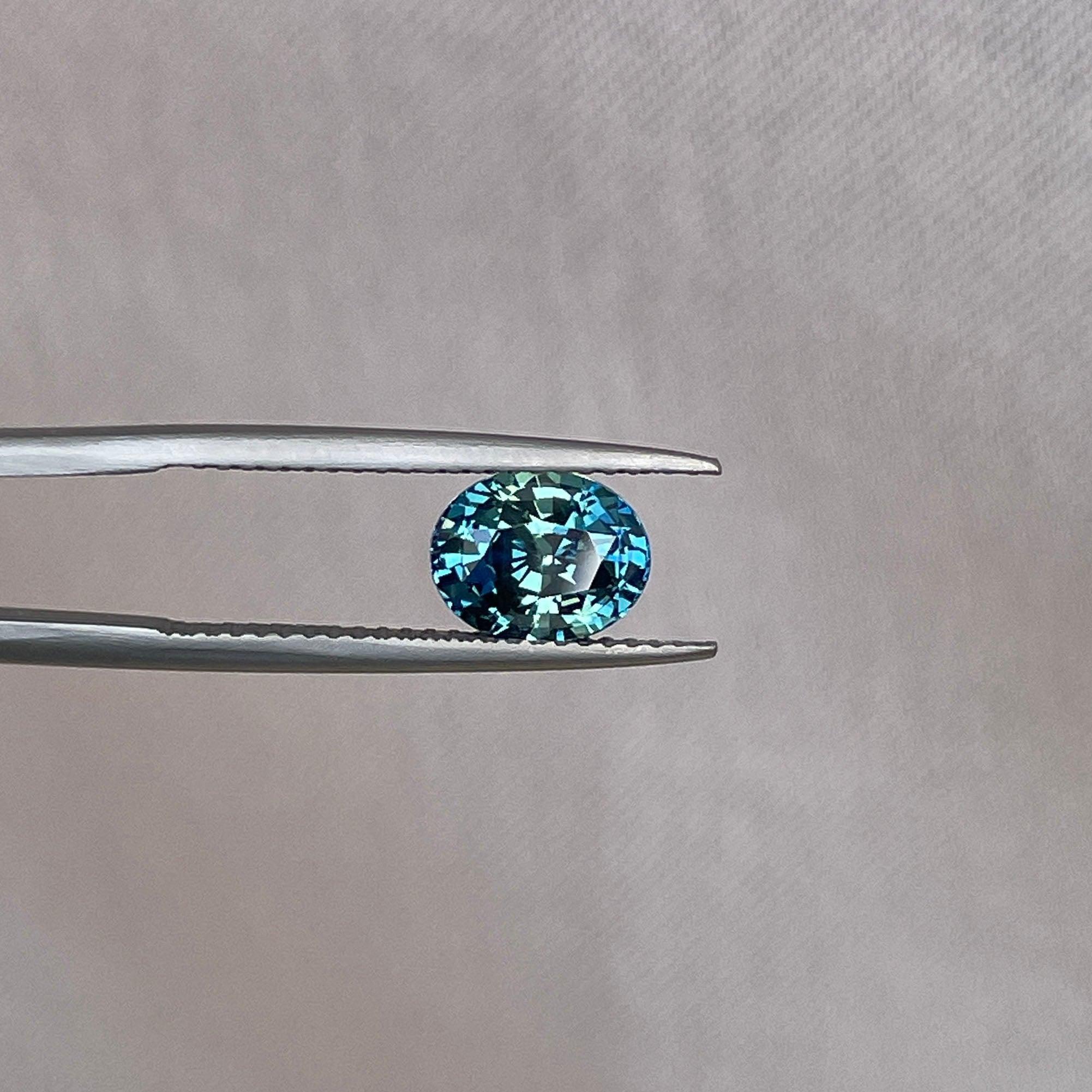 teal blue green parti sapphire oval cut gem 