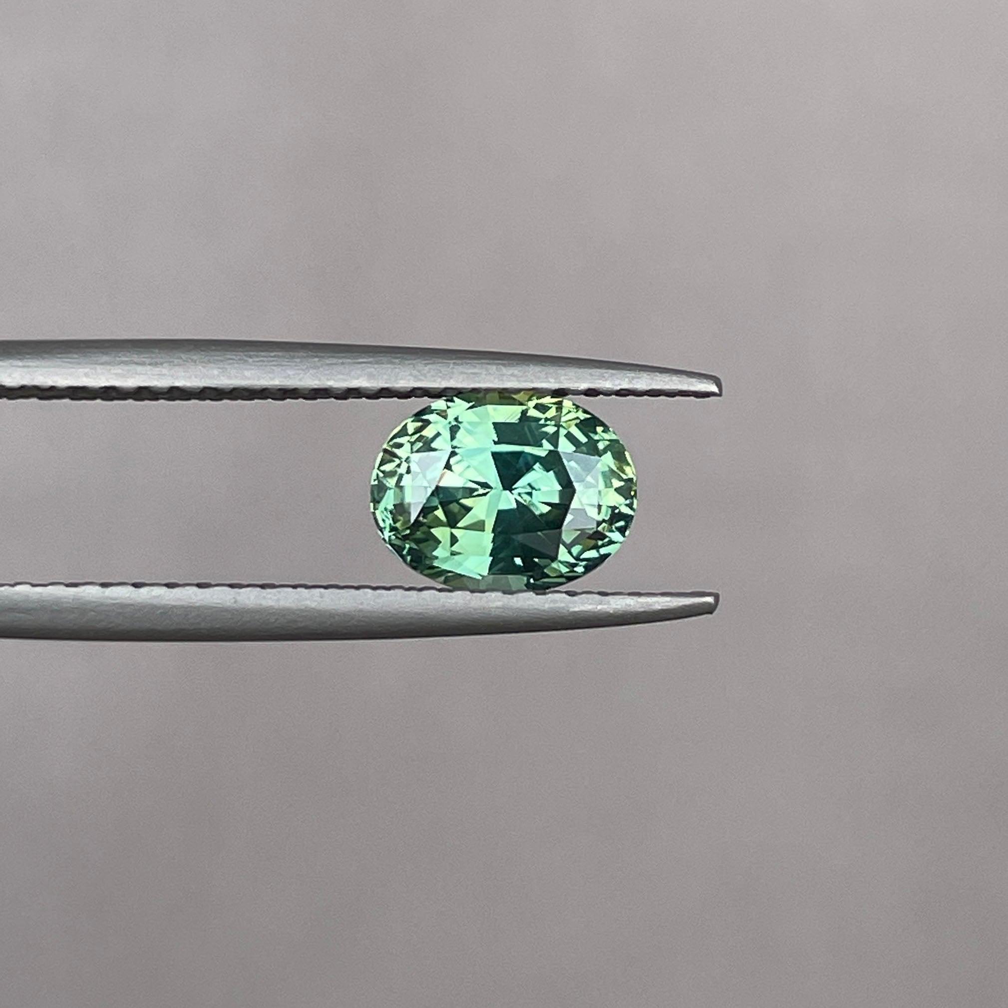 teal blue green parti sapphire oval cut gem 