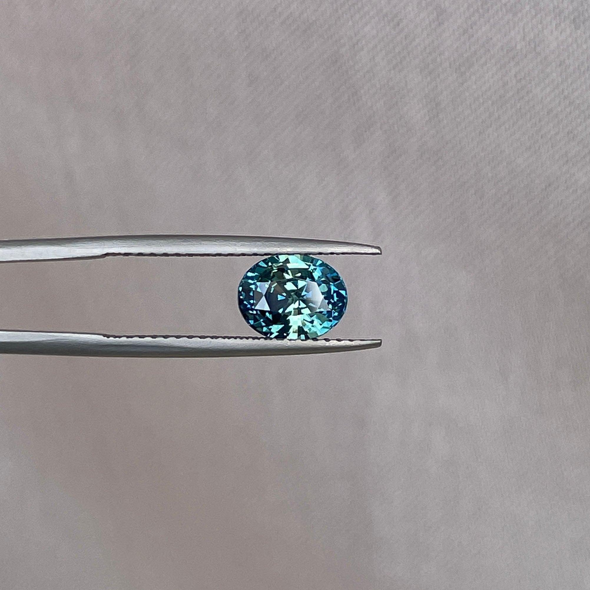 teal blue green parti sapphire oval cut gem 