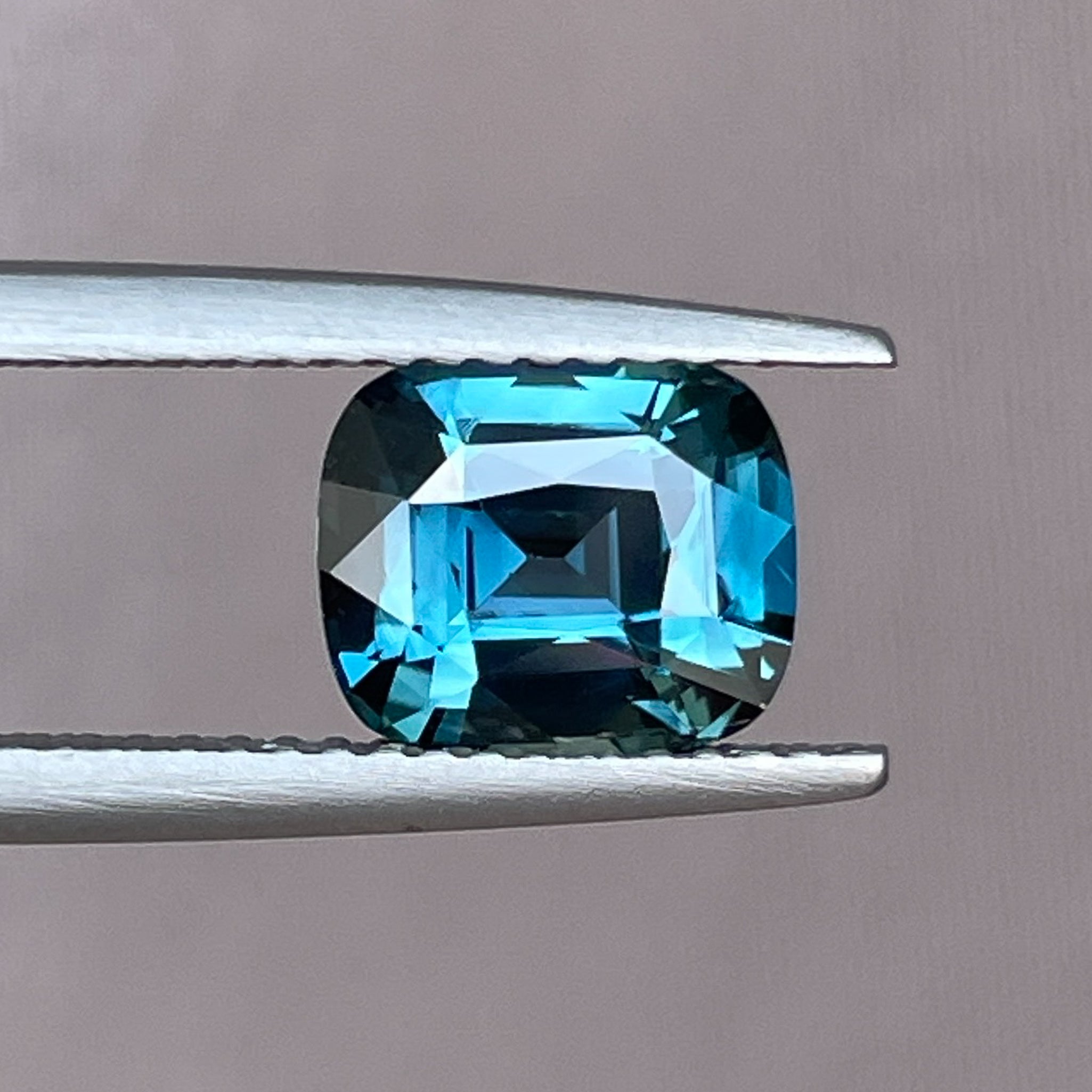 Teal blue cushion cut sapphire, 2.52 Ct loose gemstone by NASHGEMS, ideal for engagement rings or custom jewelry.