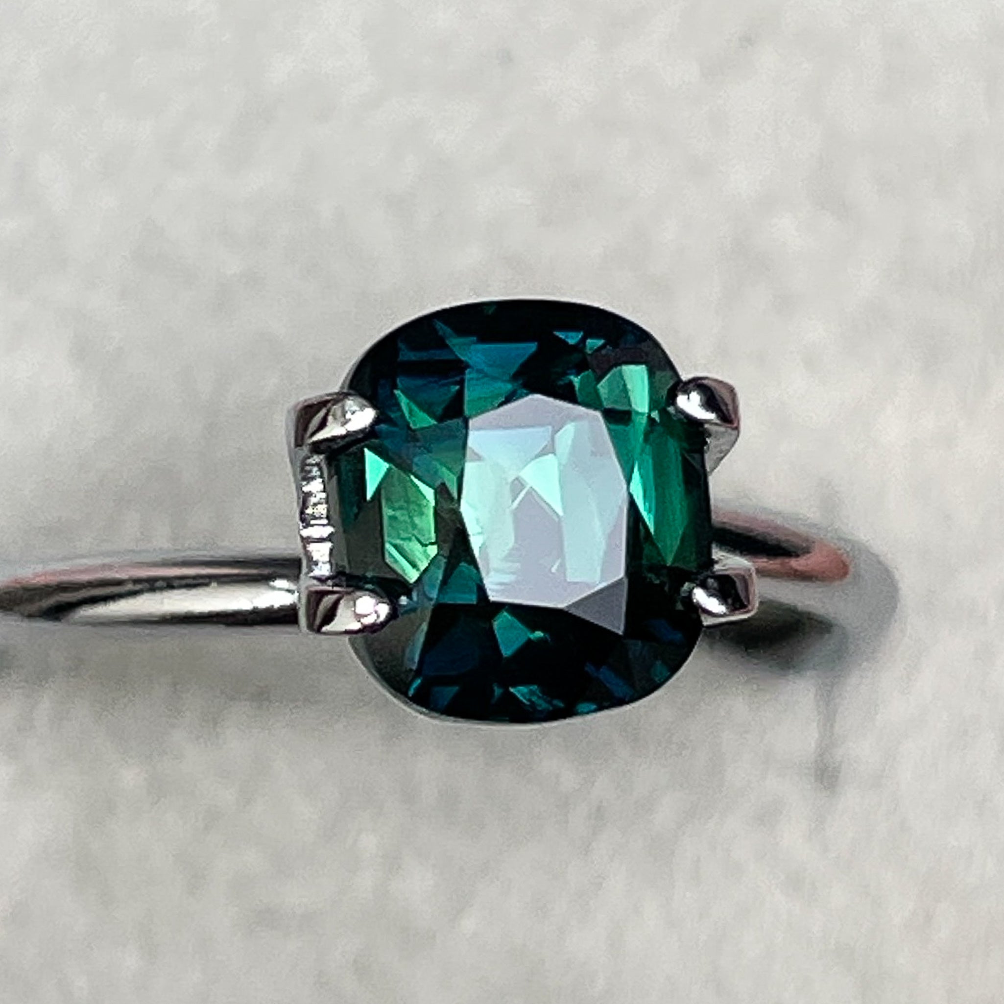 Teal green sapphire loose cushion cut 2.56 Ct from NASHGEMS, suitable for engagement rings or custom jewelry, heat treated.