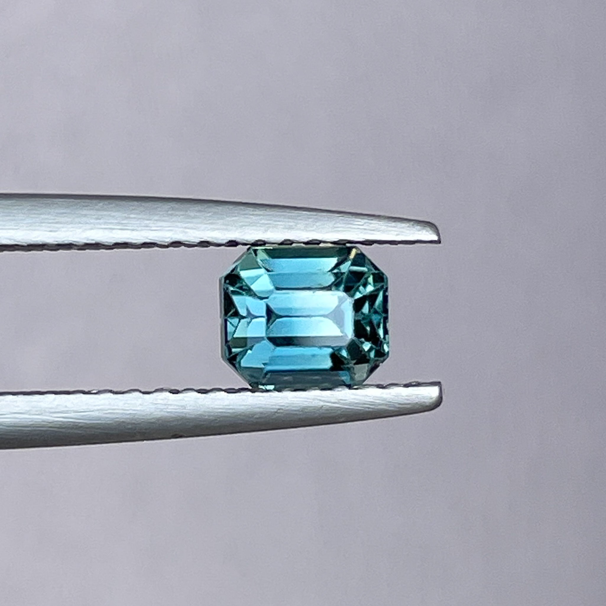 Natural teal blue sapphire 1.00 Ct emerald cut loose gemstone by NASHGEMS, ideal for engagement rings or custom jewelry.