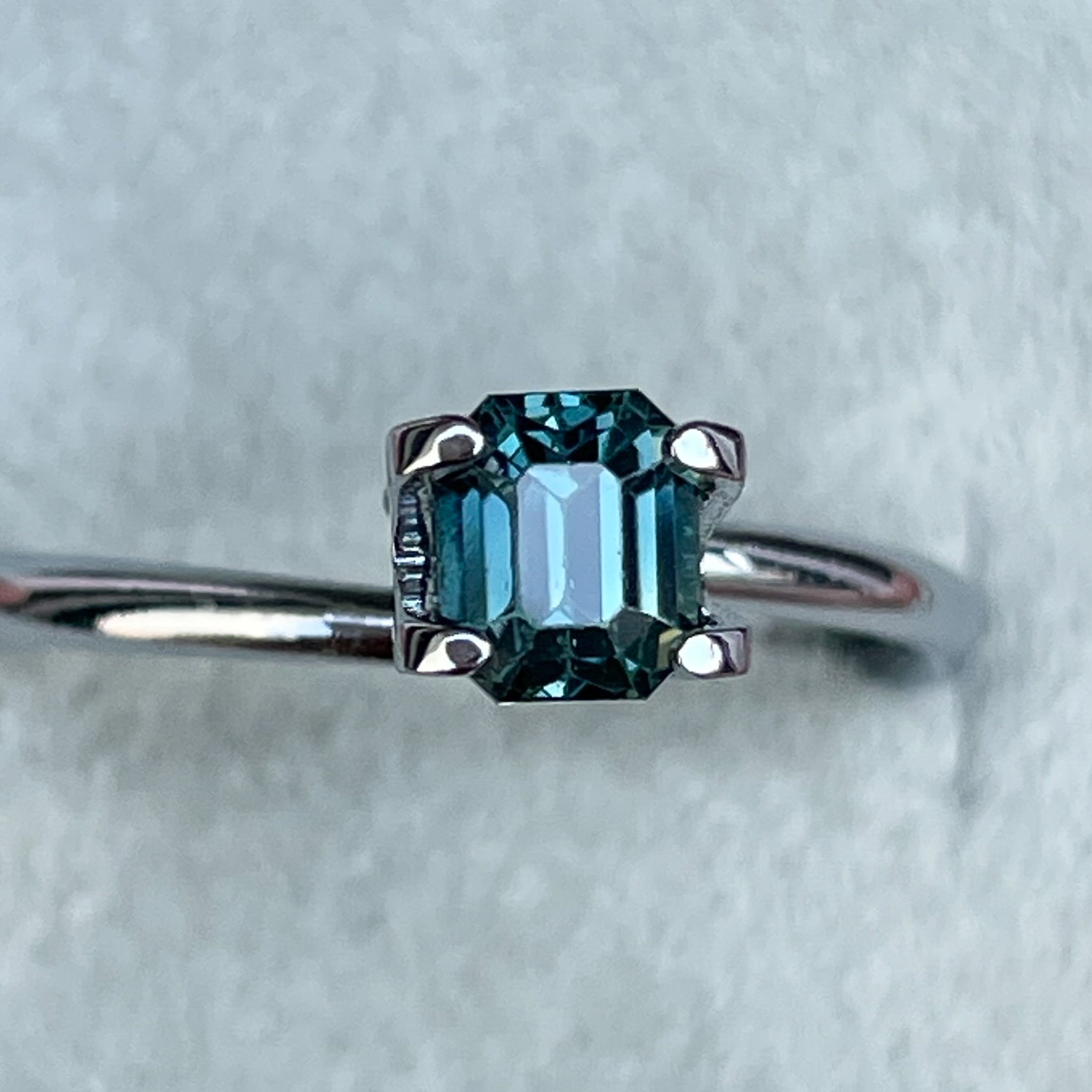 Natural teal blue sapphire 1.00 Ct emerald cut loose gemstone by NASHGEMS, ideal for engagement rings or custom jewelry.