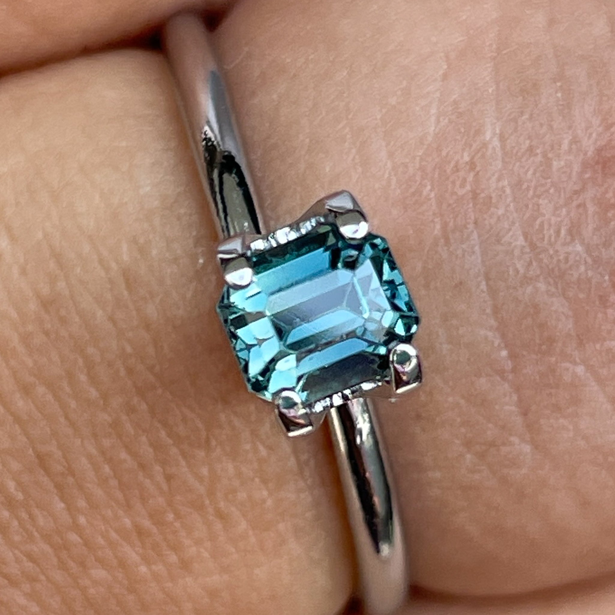 Natural teal blue sapphire 1.00 Ct emerald cut loose gemstone from NASHGEMS, ideal for engagement rings or custom jewelry.
