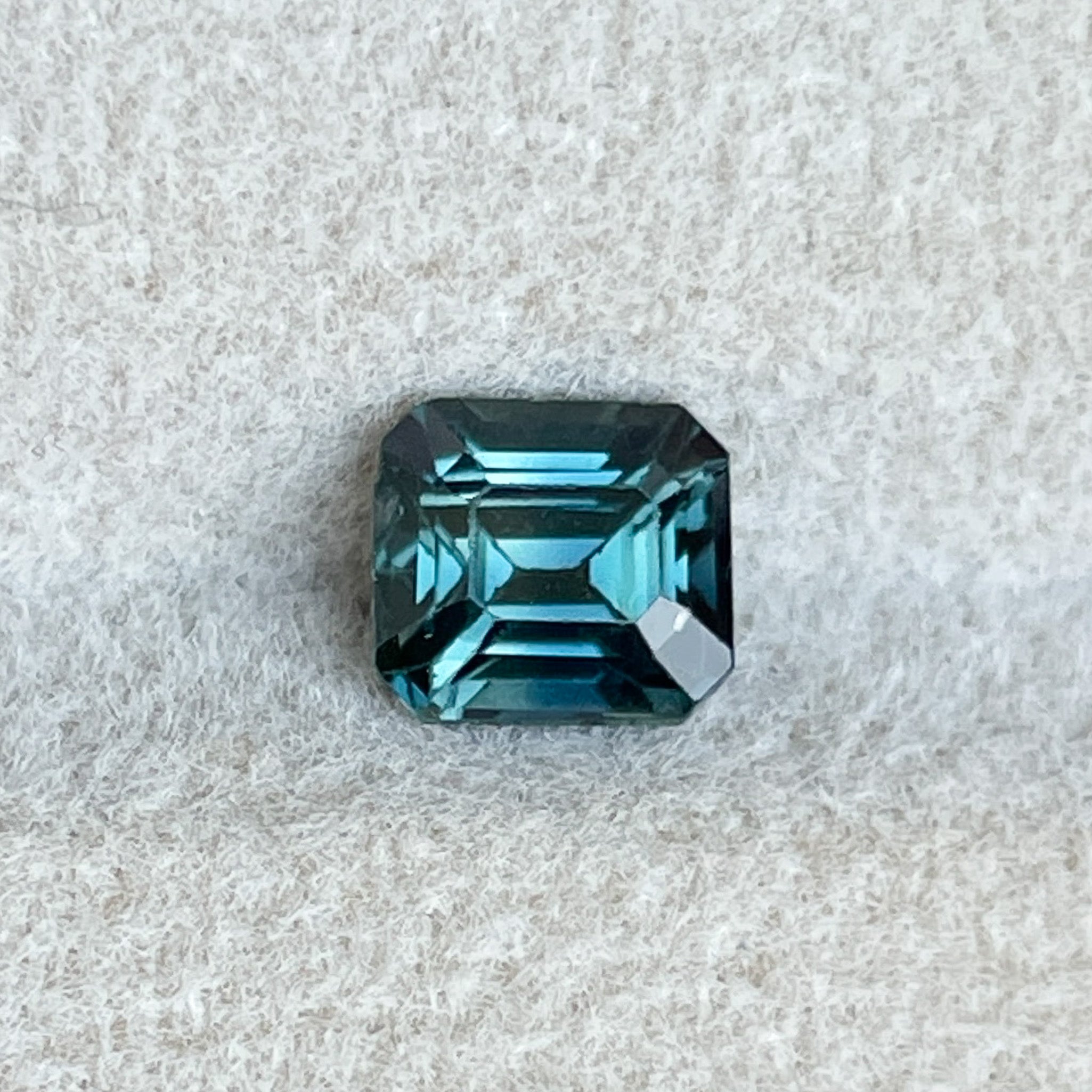 Natural teal blue sapphire loose gemstone, 1.06 Ct emerald cut, NASHGEMS, ideal for engagement rings or custom jewelry.