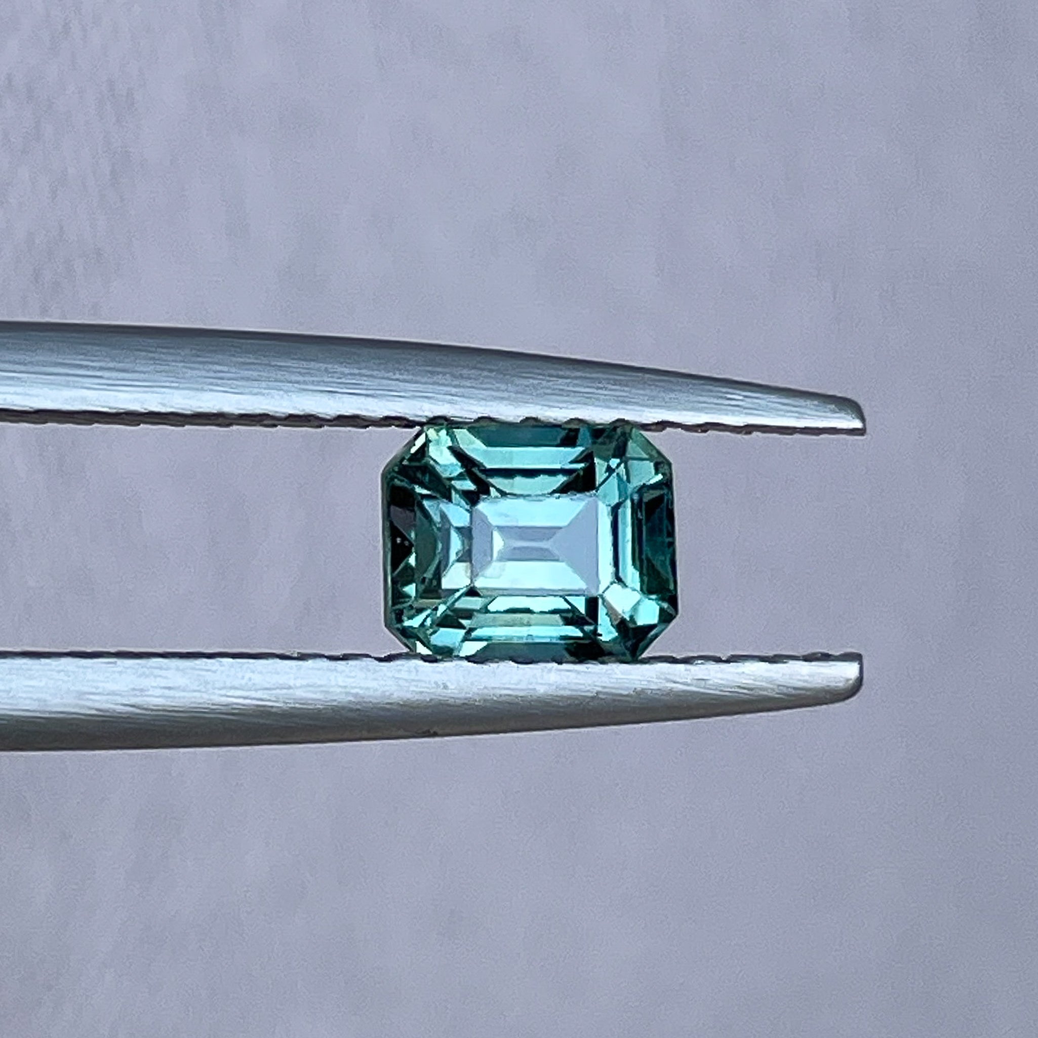 Natural teal blue-green sapphire loose gemstone, 1.05 ct emerald cut by NASHGEMS, ideal for engagement rings or custom jewelry.