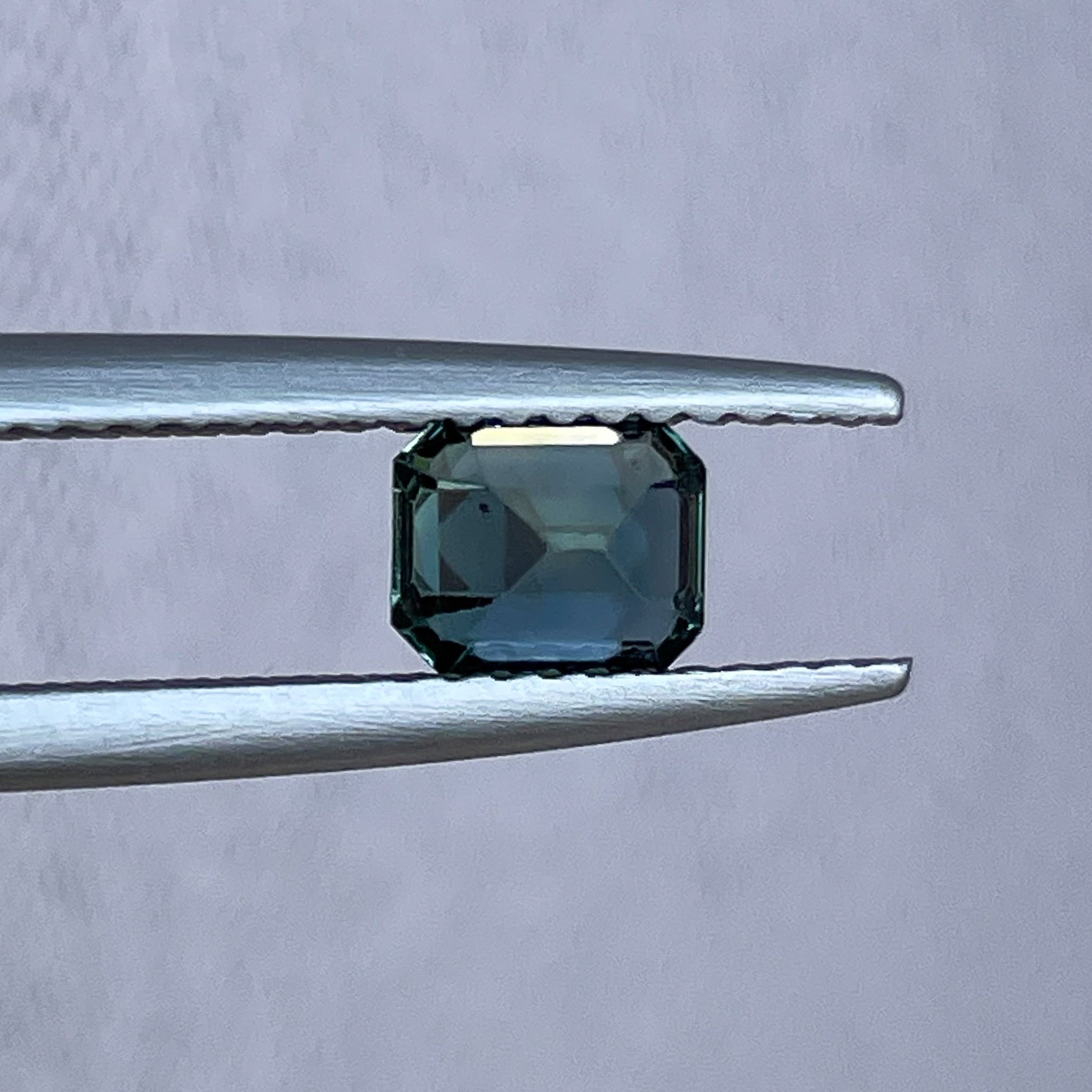 Natural teal sapphire loose stone, 1.05 Ct emerald cut by NASHGEMS, suitable for engagement rings or custom jewelry.
