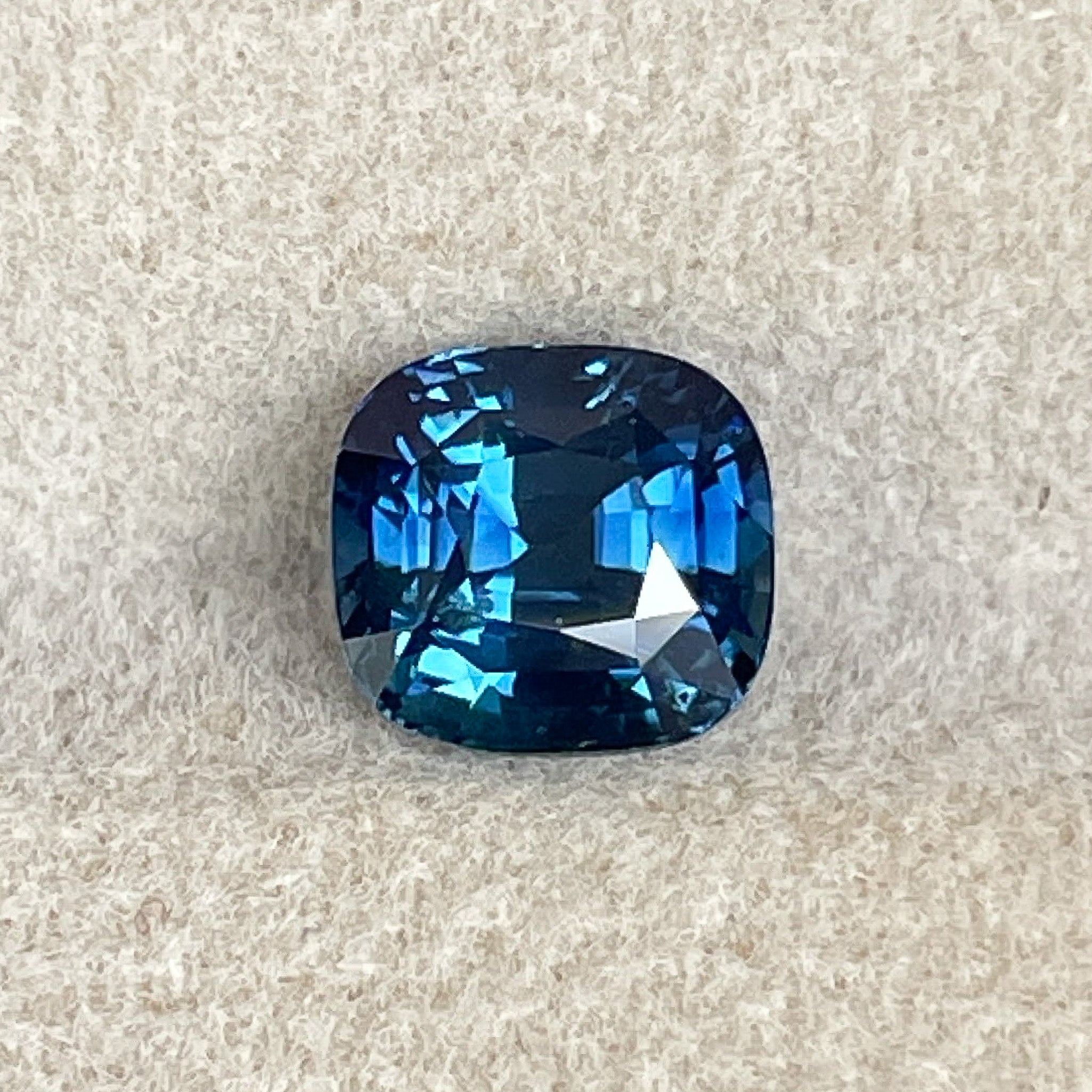 Natural teal blue sapphire, 2.07 Ct cushion cut loose gemstone from NASHGEMS, ideal for engagement rings or custom jewelry.
