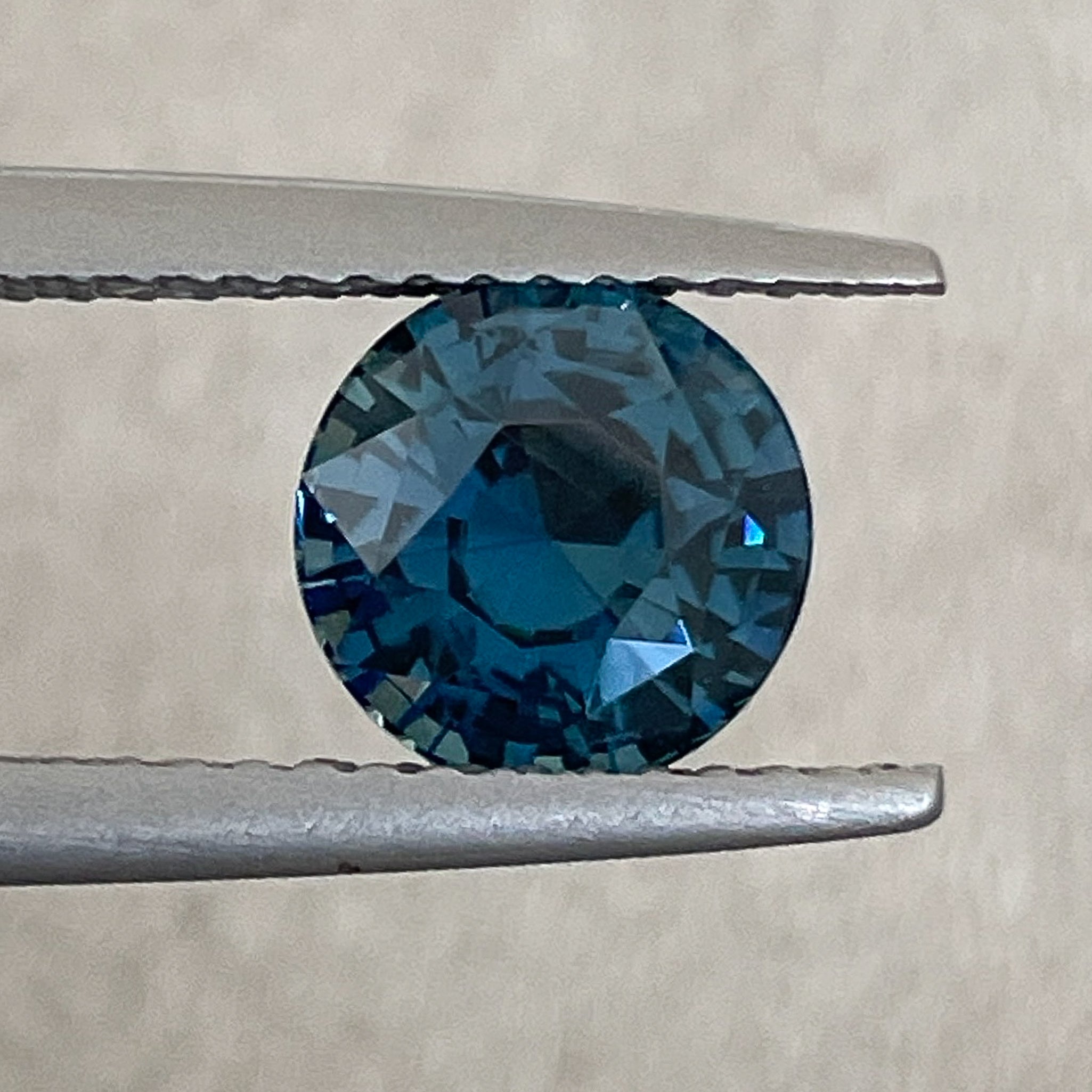 Natural teal blue sapphire, 2.10 ct round cut loose gemstone by NASHGEMS, ideal for engagement rings or custom jewelry.