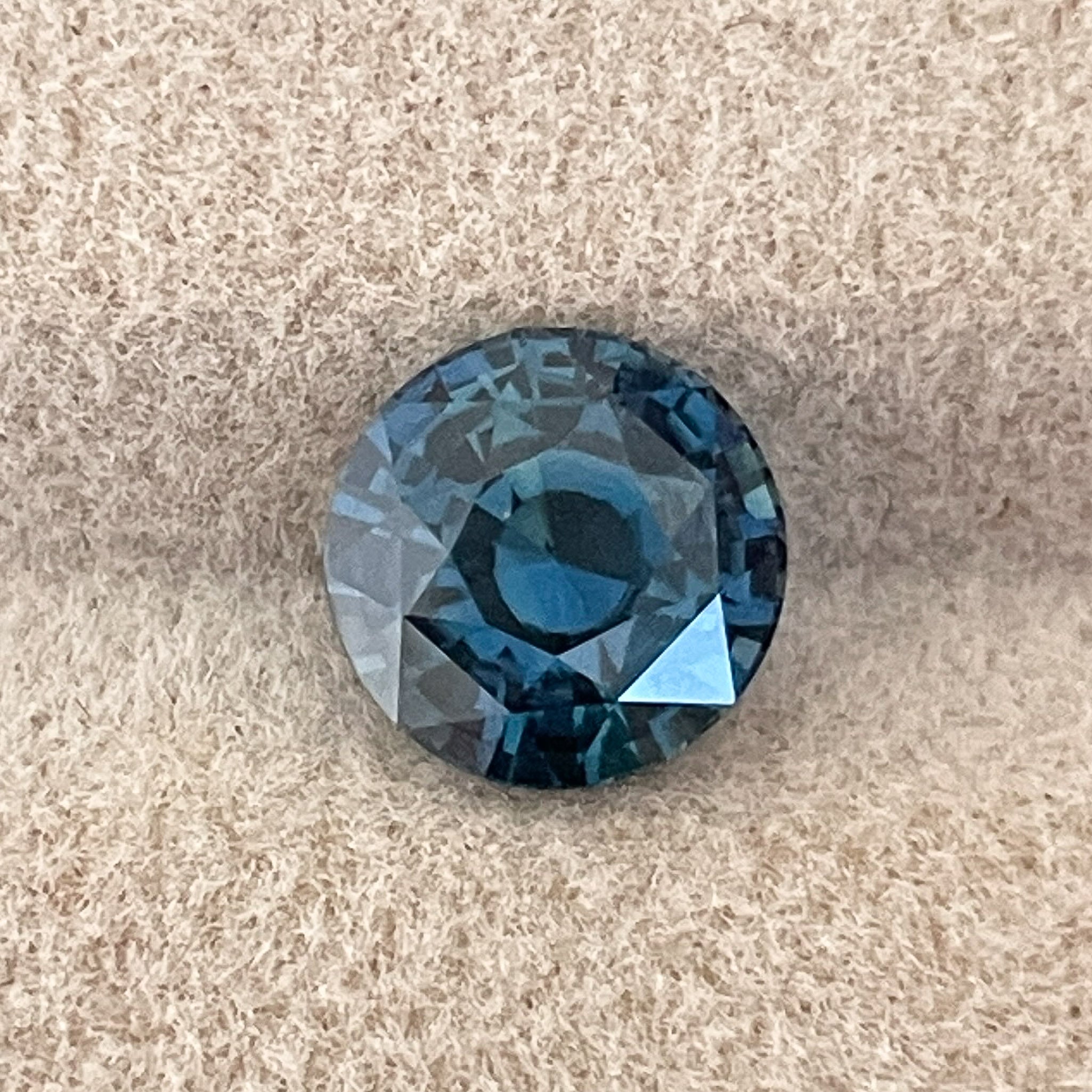 Natural teal blue sapphire, 2.10 ct round cut loose gemstone from NASHGEMS, perfect for engagement or custom jewelry.