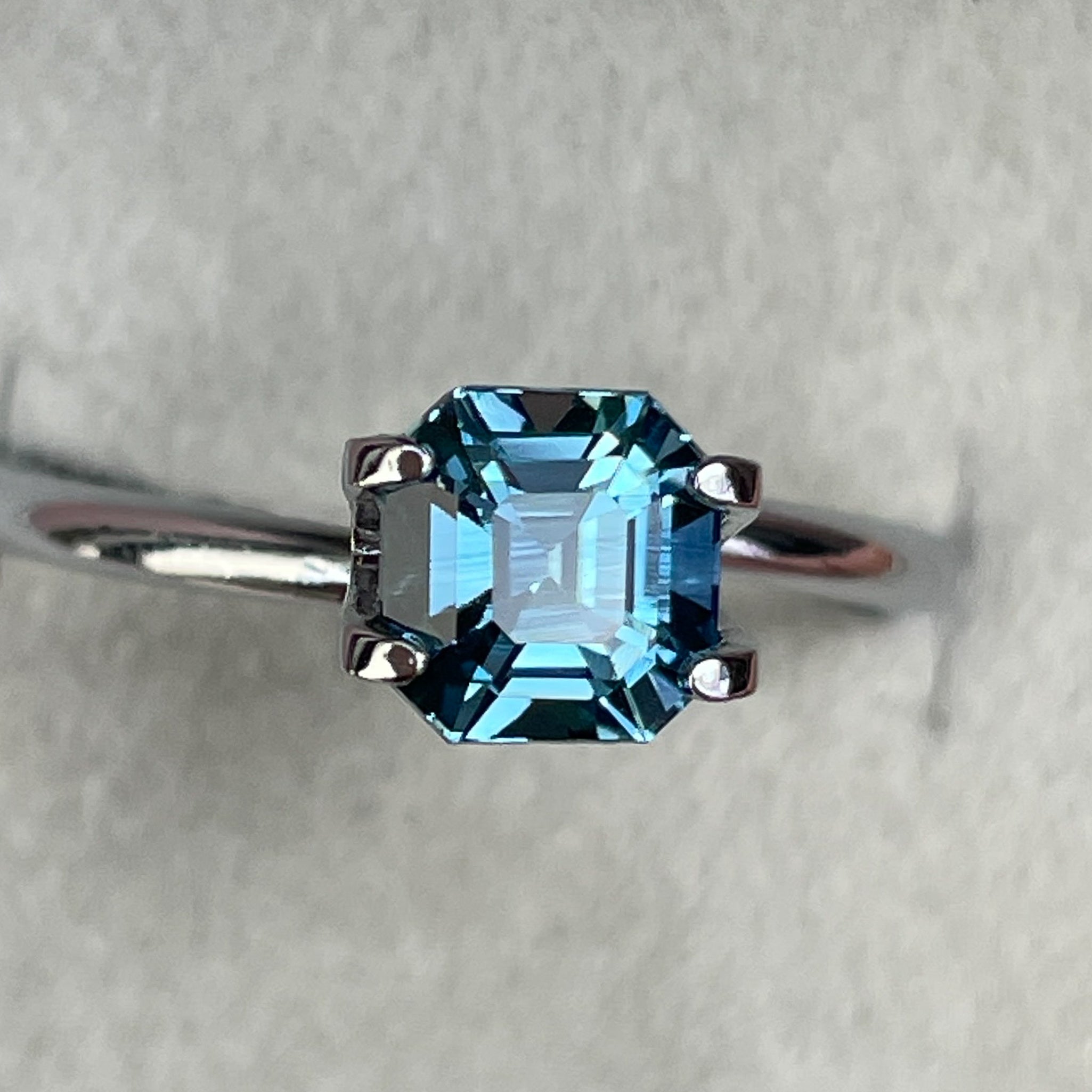 Natural teal sapphire, 1.76 Ct Asscher octagon cut, heat-treated loose gemstone by NASHGEMS for engagement or custom jewelry.