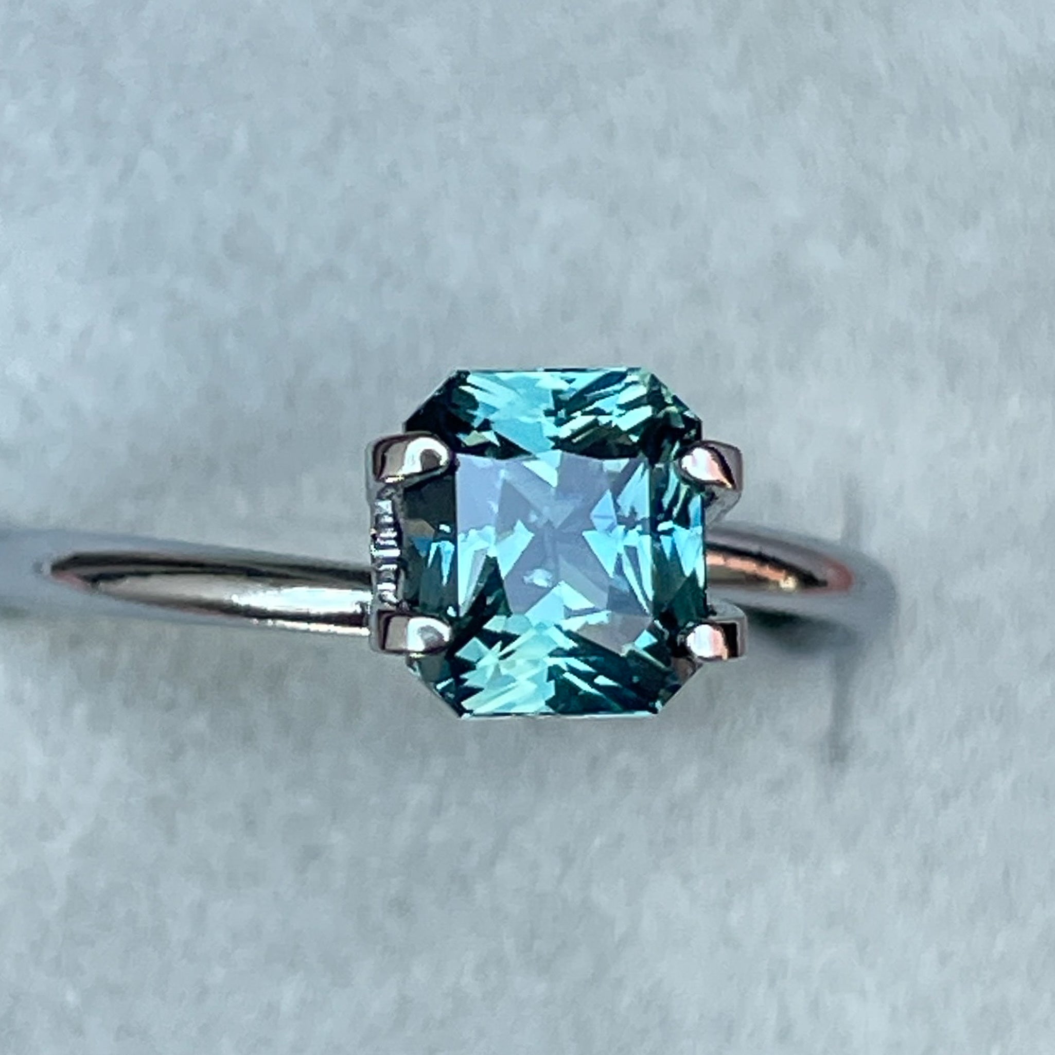 Natural teal sapphire by NASHGEMS, 1.73 Ct radiant cut loose sapphire for engagement rings or custom jewelry.