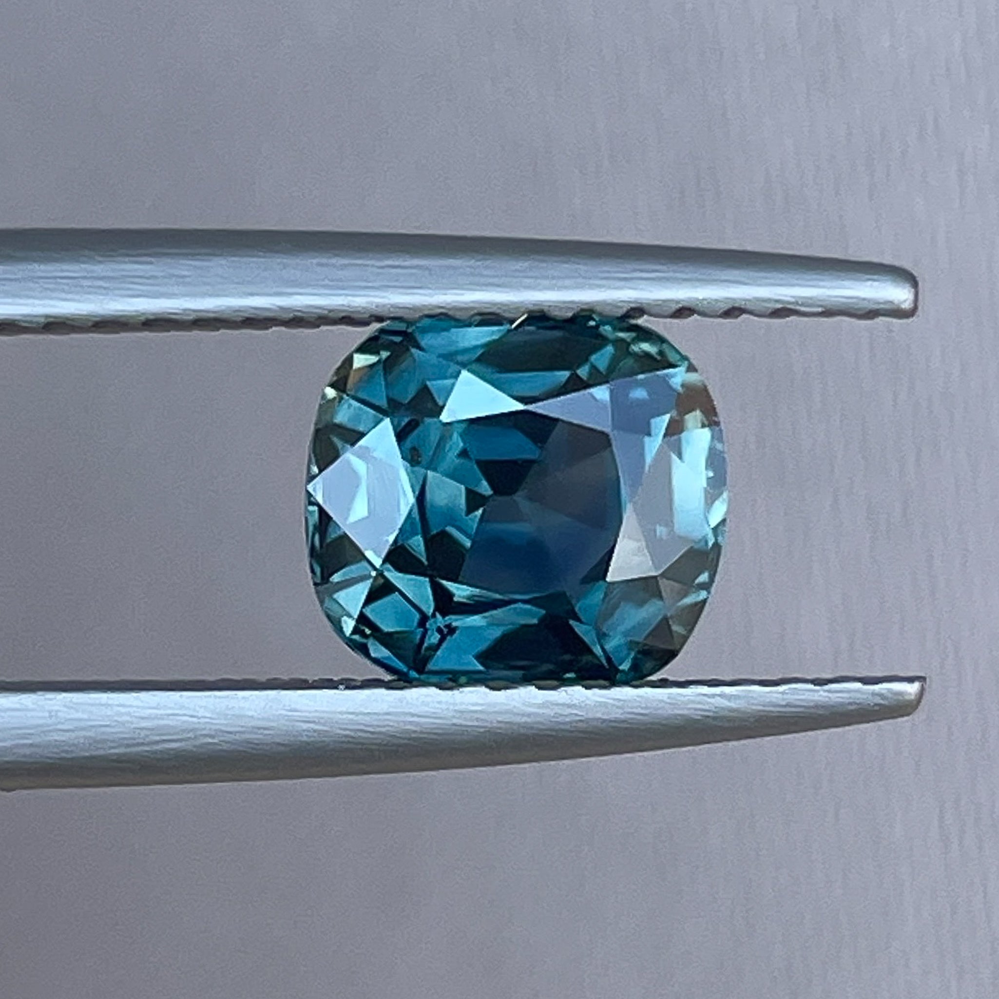 Natural teal sapphire 2.02 Ct cushion cut loose gemstone by NASHGEMS, ideal for engagement rings or custom jewelry.