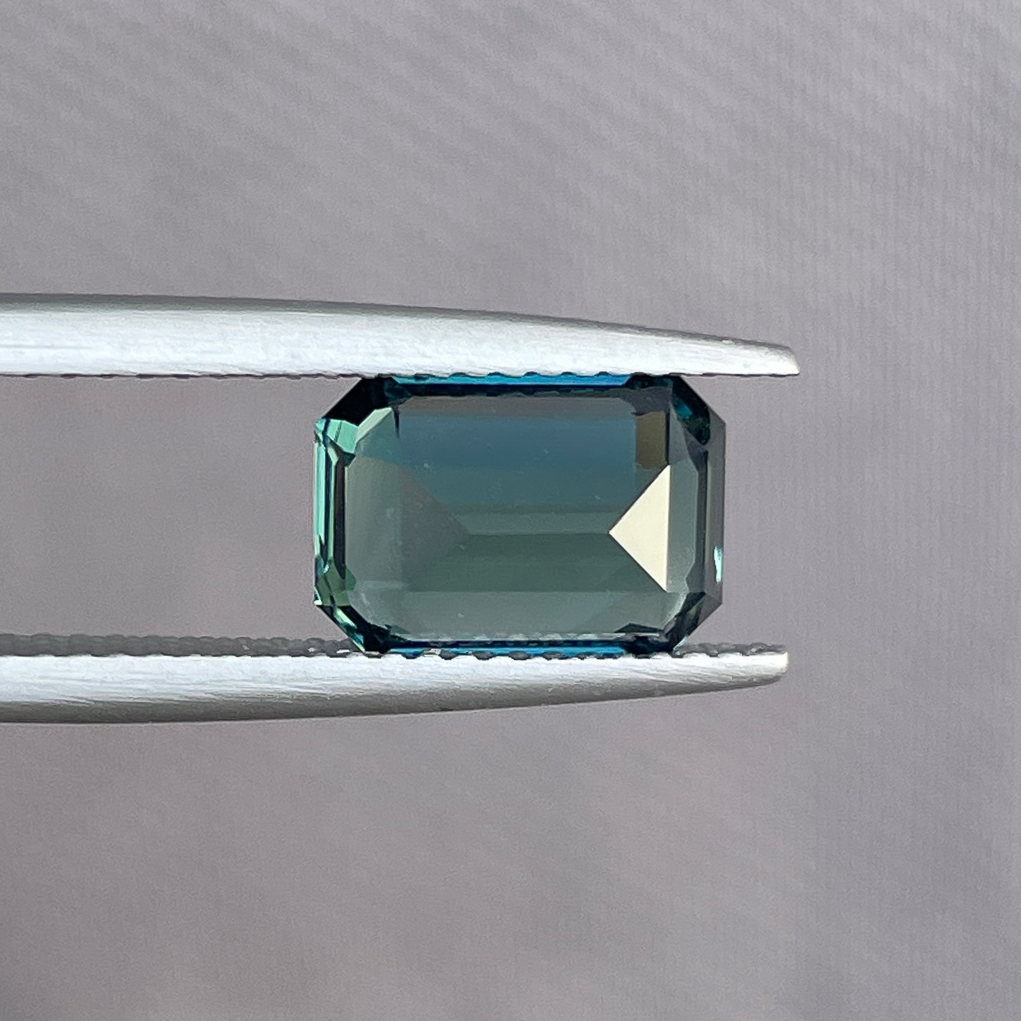 Natural teal blue green sapphire in emerald cut, 3.71 ct loose gemstone from NASHGEMS for engagement or custom jewelry.