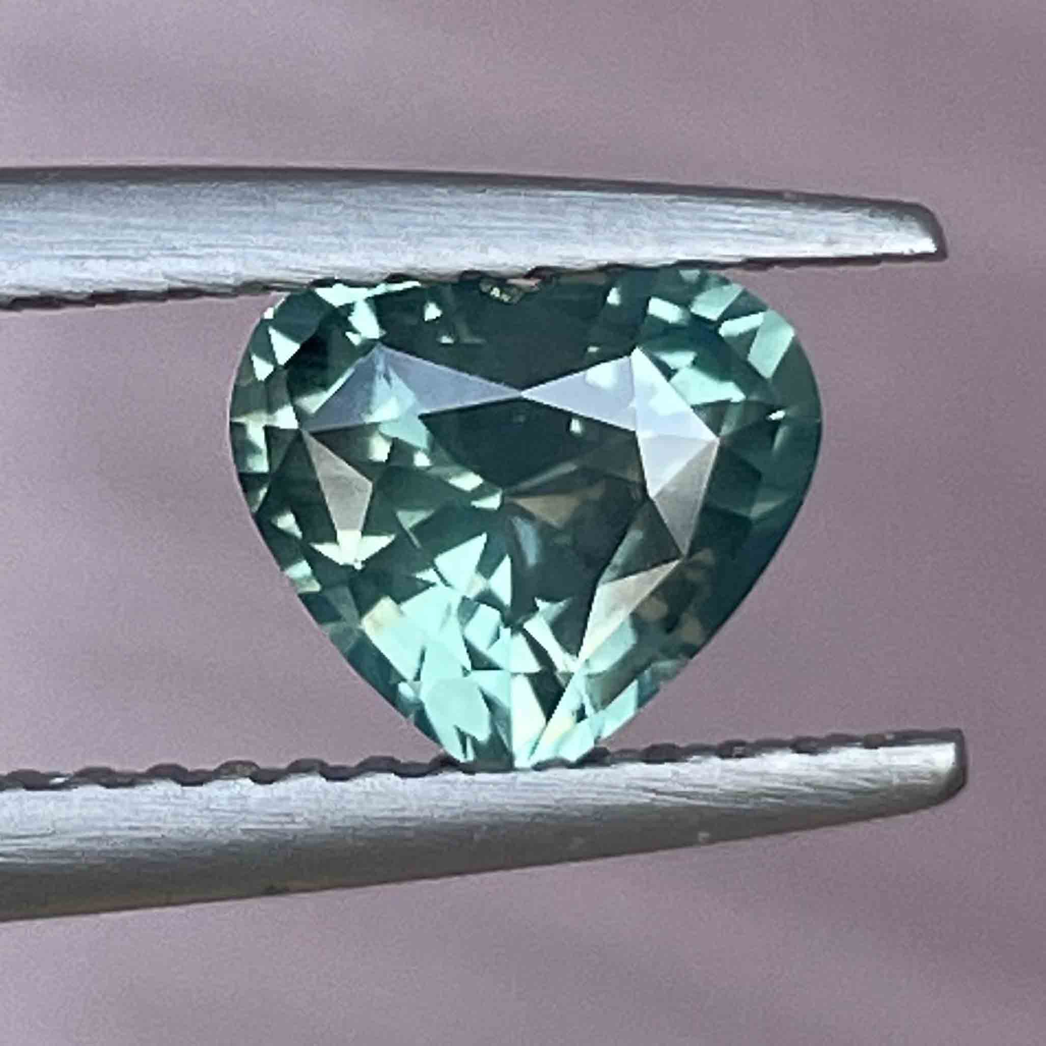 Loose teal green sapphire heart-shaped gemstone, 1.12ct, heat-treated for engagement or custom jewelry by NASHGEMS.