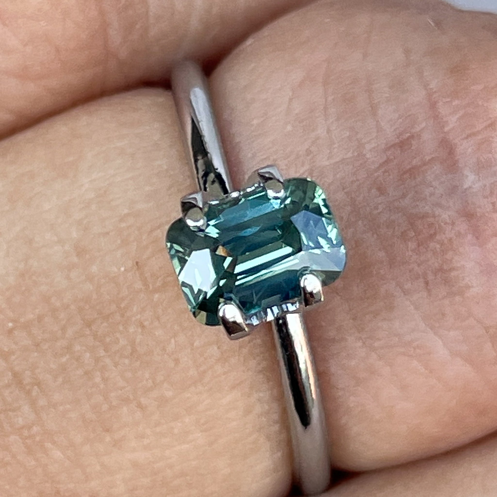 Natural pale green teal sapphire 1.14 Ct cushion cut loose gemstone by NASHGEMS, ideal for engagement rings or custom jewelry.