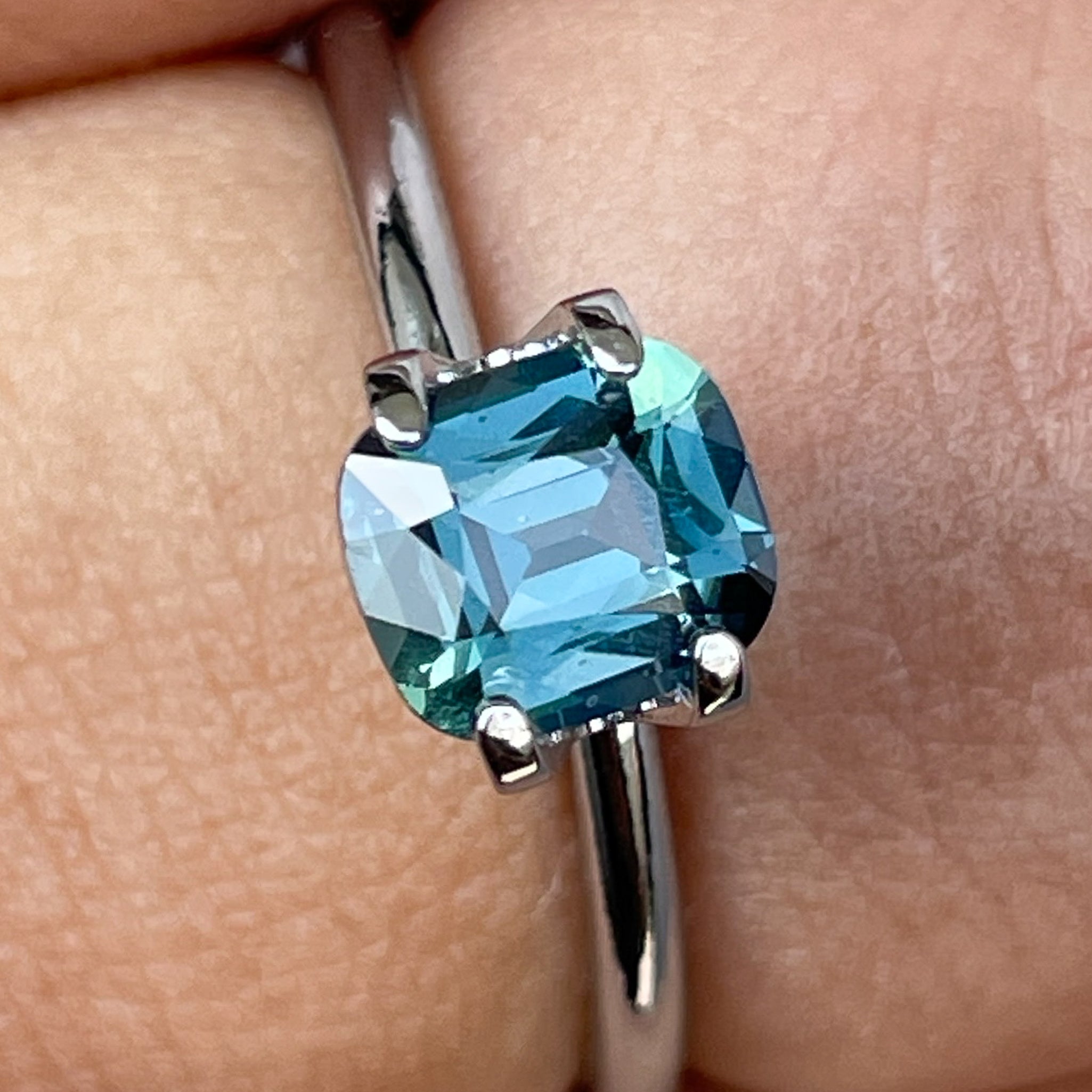Natural teal blue sapphire 1.18 ct cushion cut loose gemstone by NASHGEMS, perfect for engagement rings or custom jewelry.