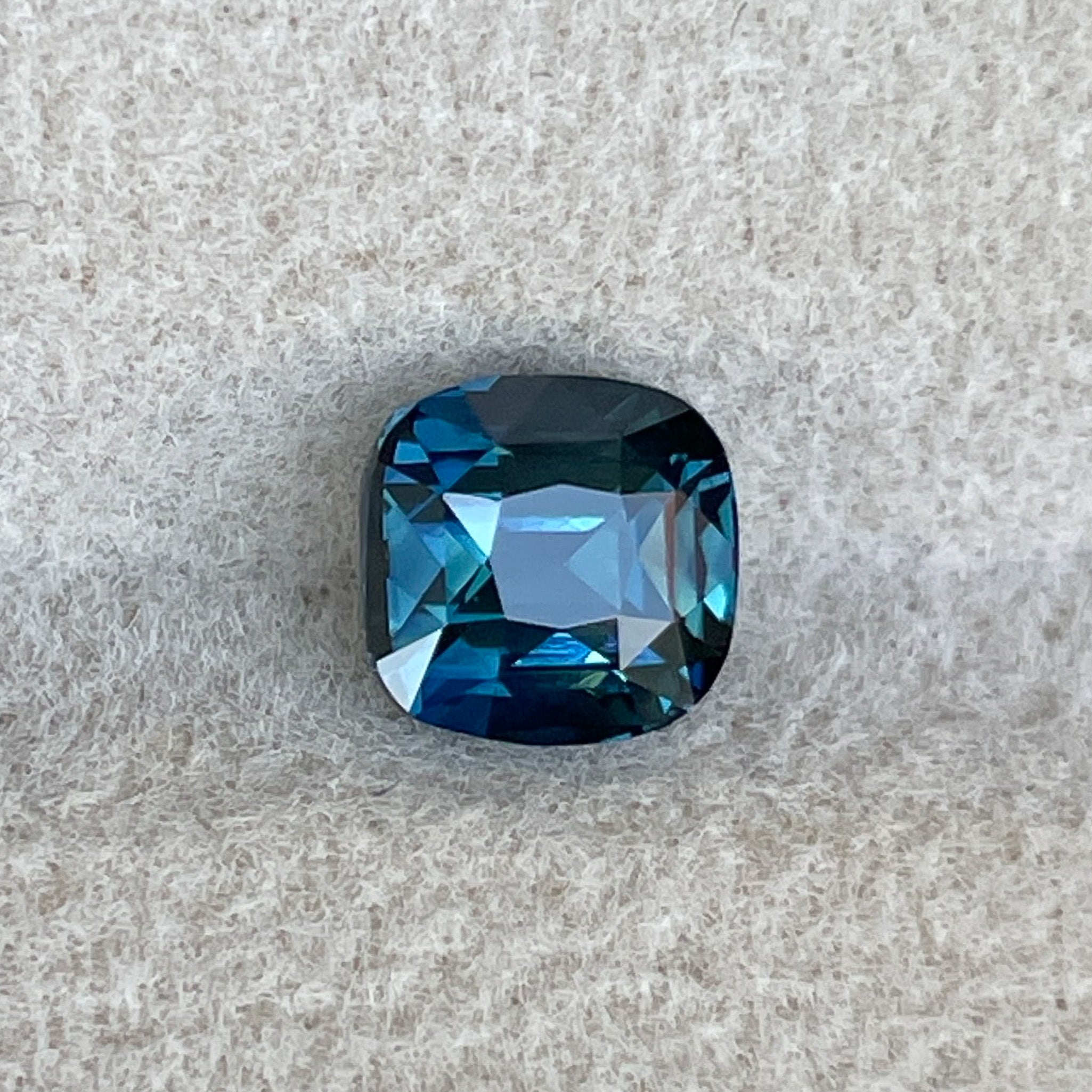 Natural teal blue sapphire loose stone, 1.52 carats, cushion cut by NASHGEMS, ideal for engagement rings or custom jewelry.