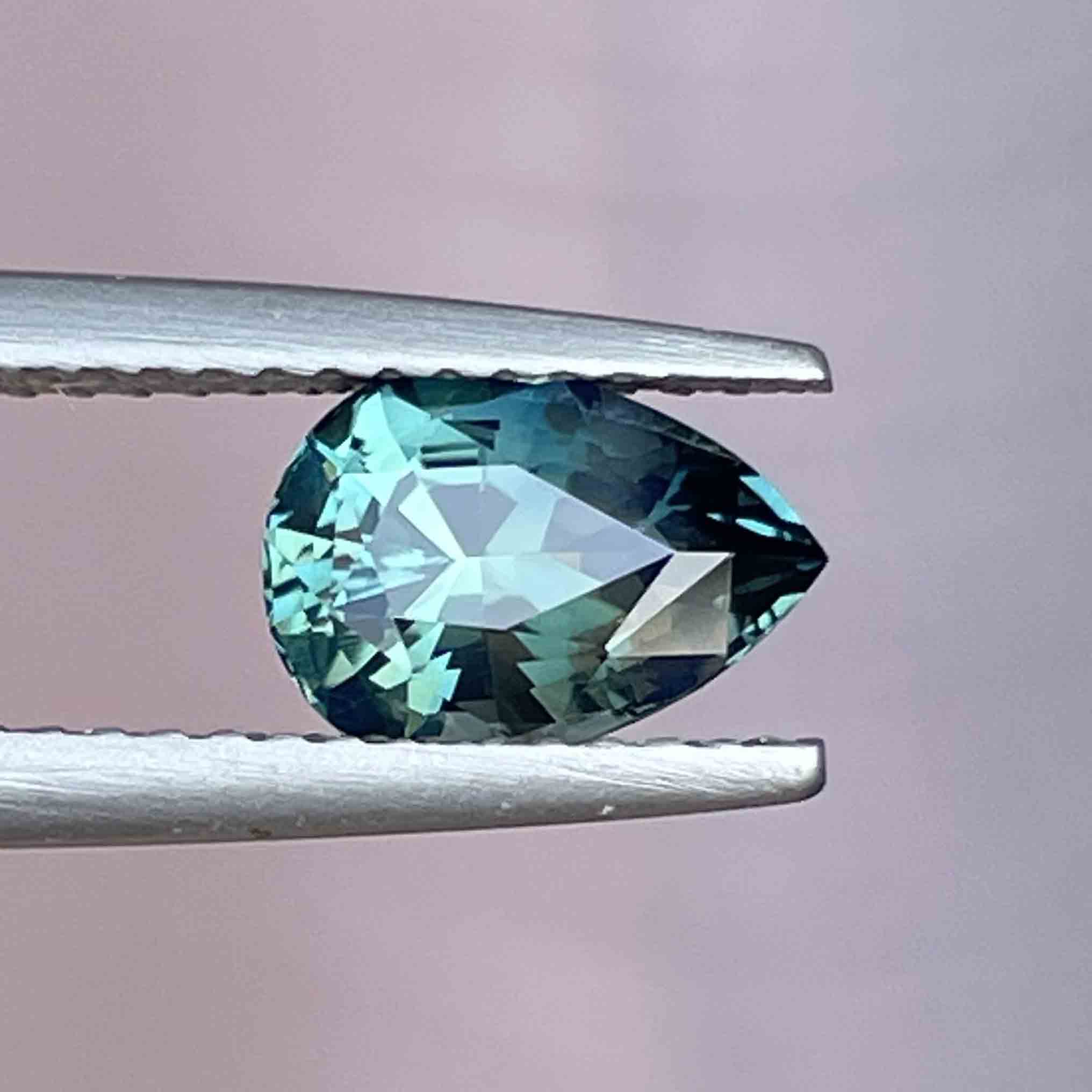 Natural teal blue green sapphire, 1.57 Ct pear-shaped loose gemstone by NASHGEMS, perfect for custom engagement rings.