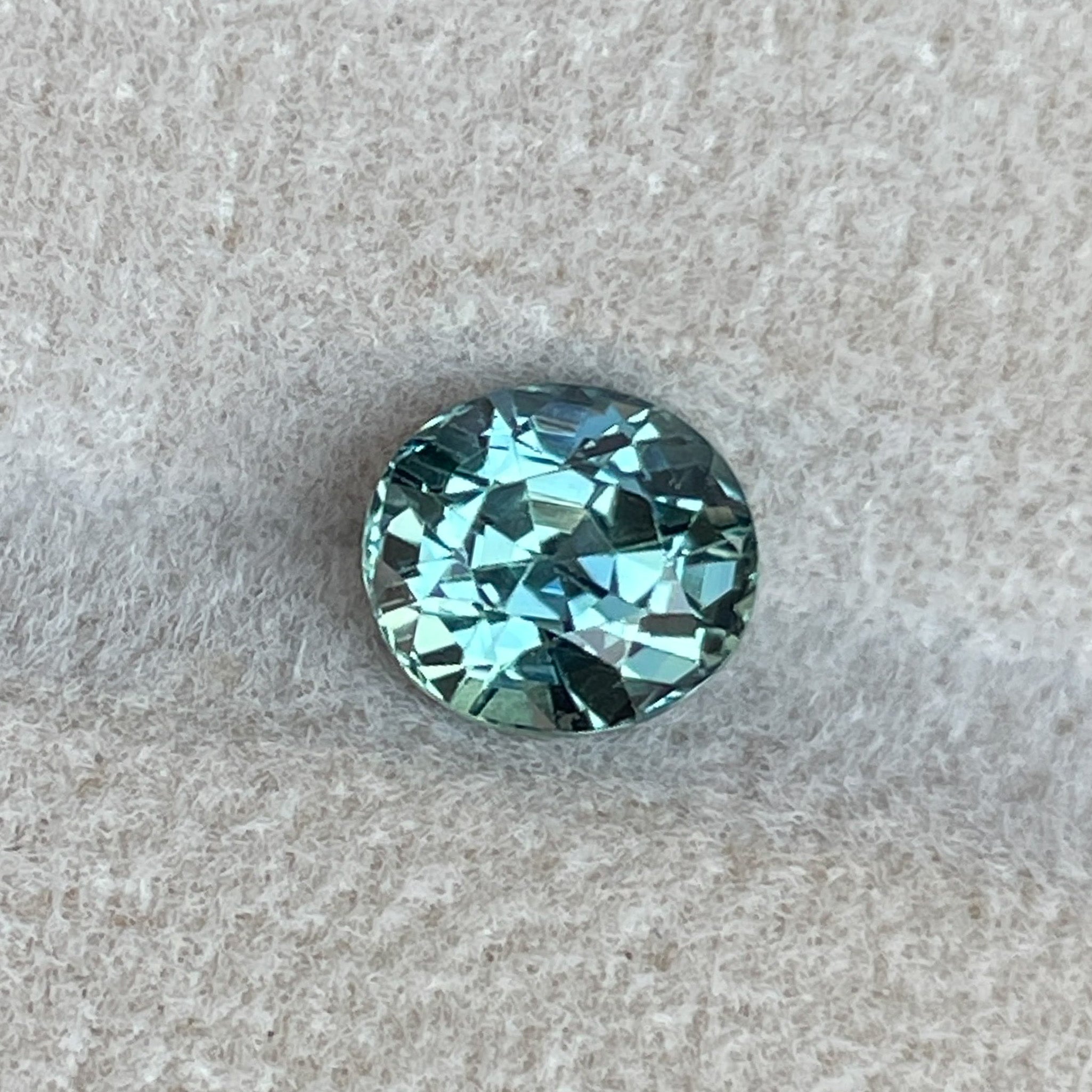 Natural teal sapphire 1.65 Ct oval cut loose gemstone from NASHGEMS, ideal for engagement rings or custom jewelry.