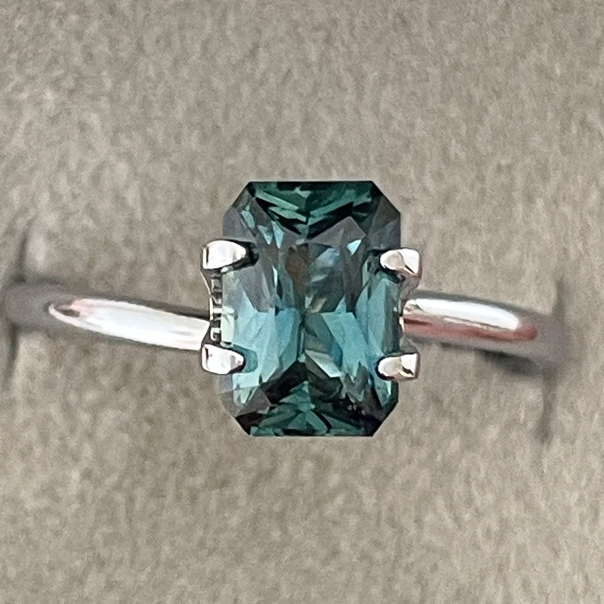 Natural teal blue-green sapphire, 1.71 ct radiant cut, loose no heat sapphire from NASHGEMS, ideal for engagement or custom jewelry.