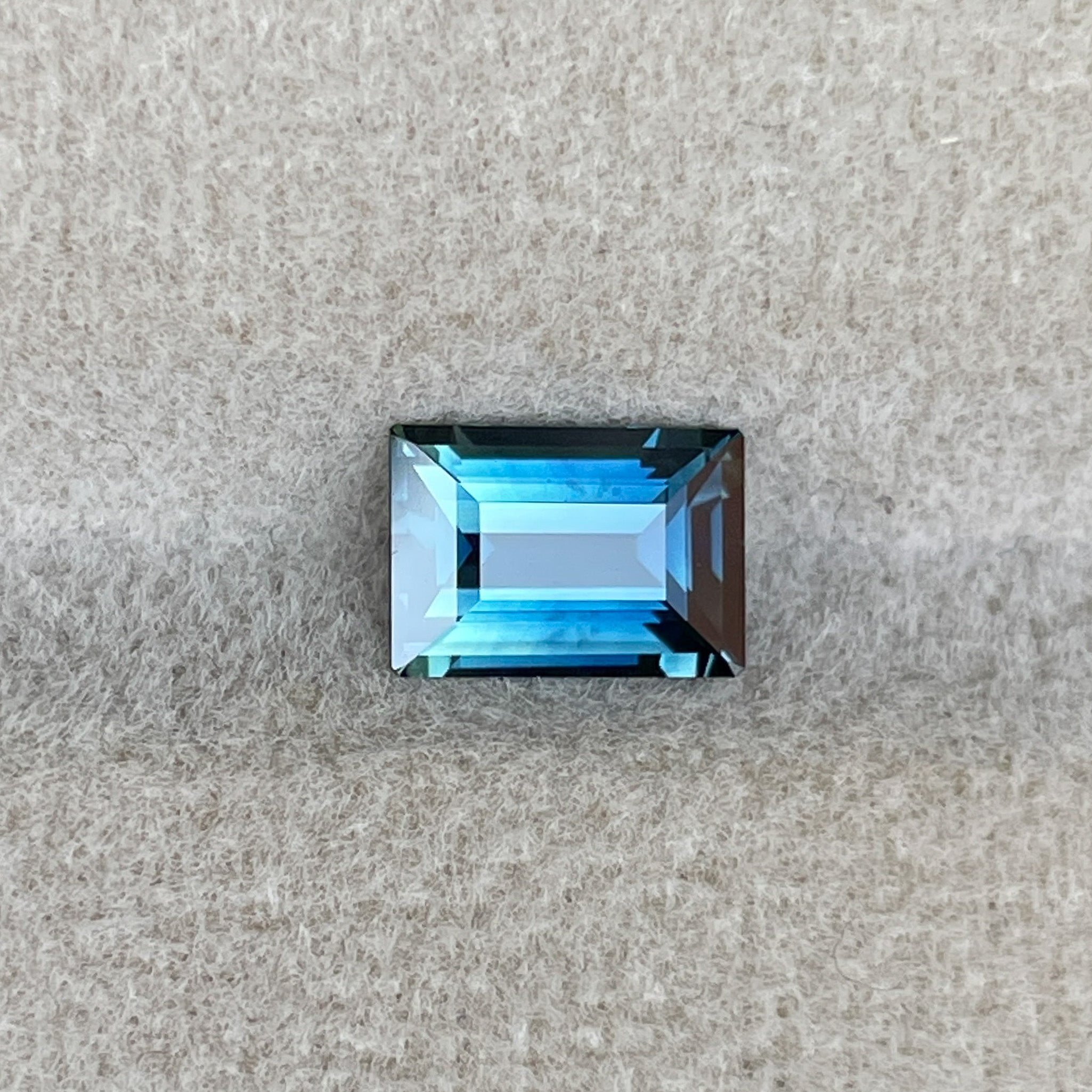 Natural teal blue sapphire 1.15 Ct in princess cut, loose gemstone from NASHGEMS for engagement rings or custom jewelry.